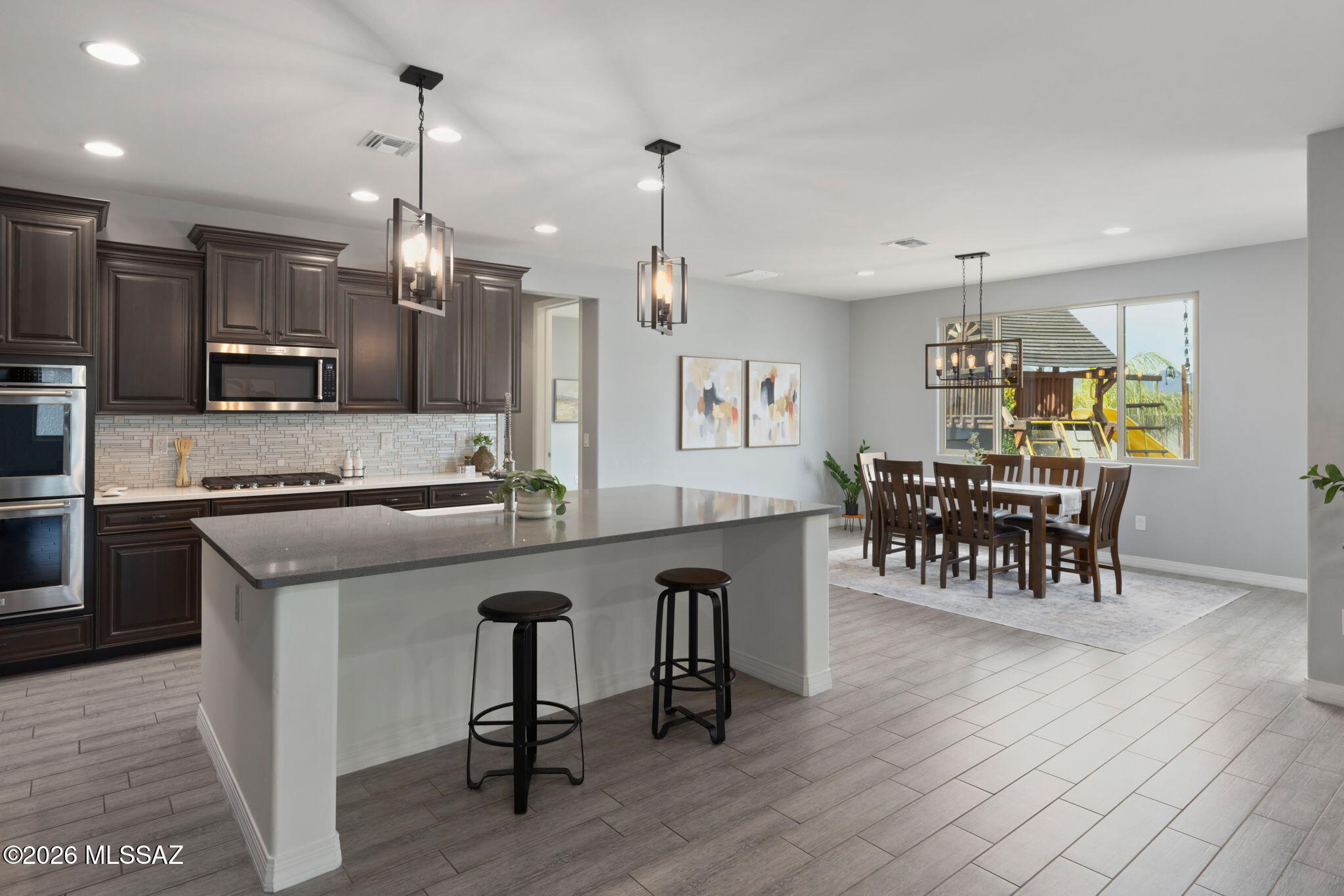 Seller will accept or counter offers between $695,500-$715,000.
Set against the stunning backdrop of Oro Valley, this 2018-built Meritage Sonoita model offers the space, design, and flexibility you've been searching for. With 5 bedrooms, multiple living areas, and a thoughtfully designed layout, this home adapts beautifully to the way you live. Plus a backyard you may never want to leave!

As you head inside, the heart of the home opens to a light-filled great room that flows into a spacious, modern kitchen designed to impress. Quartz countertops, executive-height cabinetry with soft-close drawers, an expansive pantry with a spot for everything and prep space that makes everyday living effortless. Three additional rooms downstairs provide options- an office that overlooks the gorgeous backyard, a quaint bedroom ideal for a music room, workout space or guests, and a media room with a half bathroom nearby. Movie nights just got better!

Upstairs, a generous loft creates the perfect secondary living space - ideal for homework zone, game lounge, or play area. 3 additional bedrooms, one with its own ensuite bathroom, and a primary bedroom suite with mountain views out all windows give you room to grow. This layout offers flexibility for multigenerational living, remote work, or simply spreading out.

Outside, a backyard designed for connection and entertaining! This space is ready for weekend barbecues, evening conversations, and enjoying Arizona's beautiful sunsets and peek a boo Tortolita Mountain views. 

Located in one of the most desirable gated communities (and on a corner end lot), this home is surrounded by highly rated schools, scenic trails, golf, parks, and popular local dining. Living in Oro Valley means enjoying mountain views, active outdoor living, and the convenience of nearby amenities. Modern construction, energy efficiency, abundant space, and a prime location- this is a home designed to support your next chapter.