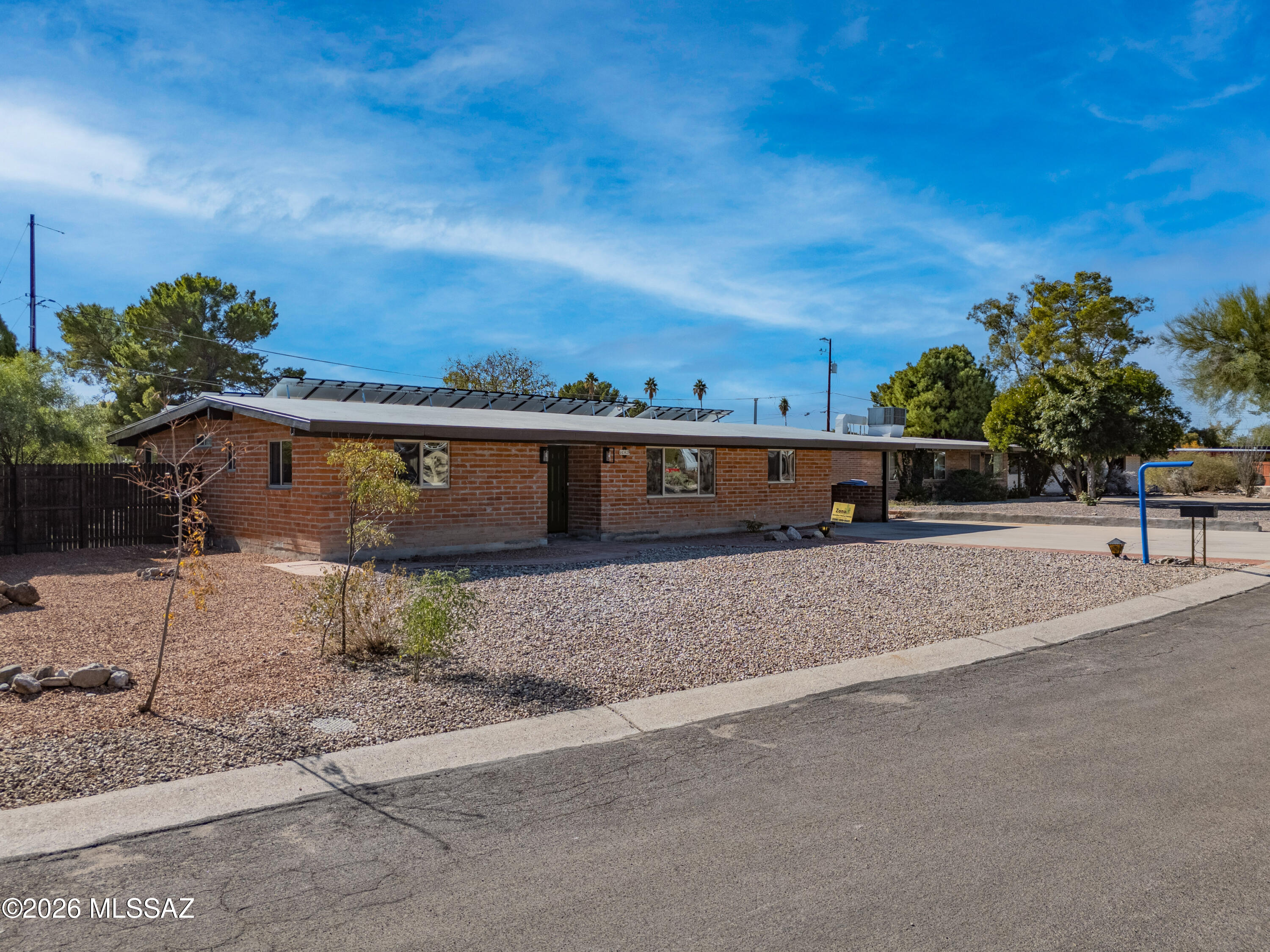 Fully remodeled mid-century brick home off Old Ft. Lowell Rd., in a quiet, sought-after pocket of Tucson. Catalina Mountain views right from the living room. Brand new kitchen with new cabinets, granite countertops, and appliances. New vinyl plank flooring, light fixtures, and windows throughout. Fresh interior and exterior paint inside and out. HVAC fully serviced, roof recoated within the last year, and solar fully paid off and owned -- no lease, no payment, just savings from day one.
Private backyard oasis with covered patio and desert rock landscaping. Walking distance to the Rillito River Walk, Plaza Palomino, and Lohse YMCA at McCormick Park.
Roof, HVAC, solar -- all handled. Just move in