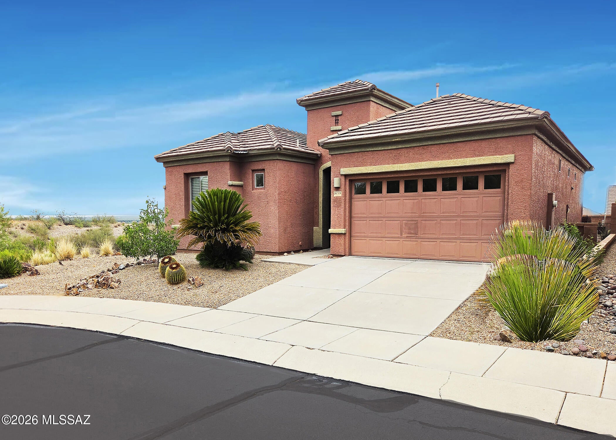 If you are seeking a home in a desirable gated Canoa Ranch community, your search is over!  This 1,640 square-foot, thoughtfully designed home features 2 bedrooms, 2 bathrooms, an office complete with a built-in desk and Murphy bed, plus a 2-car garage with ample storage.  It boasts an open-concept floor plan, highlighted by the built-in entertainment center in the great room, and a chic palette of dark flooring and countertops that gives the home a slightly sophisticated feel.

Step outside to the secluded rear patio, ideally positioned adjacent to an arroyo.  It's a perfect place to enjoy your own mountain view while sipping morning coffee or afternoon cocktails. 
With its ideal flow between the indoor and outdoor living spaces, this home was made for entertaining family and friends. The property is conveniently located near golf, GVR facilities, with easy access I-19.  It is an ideal full-time home, winter retreat, or investment property.  And best of all, peace of mind comes with a transferable Liberty Home Guard home warranty paid up through July 24, 2029.  This is an exceptional added benefit for the next owner!