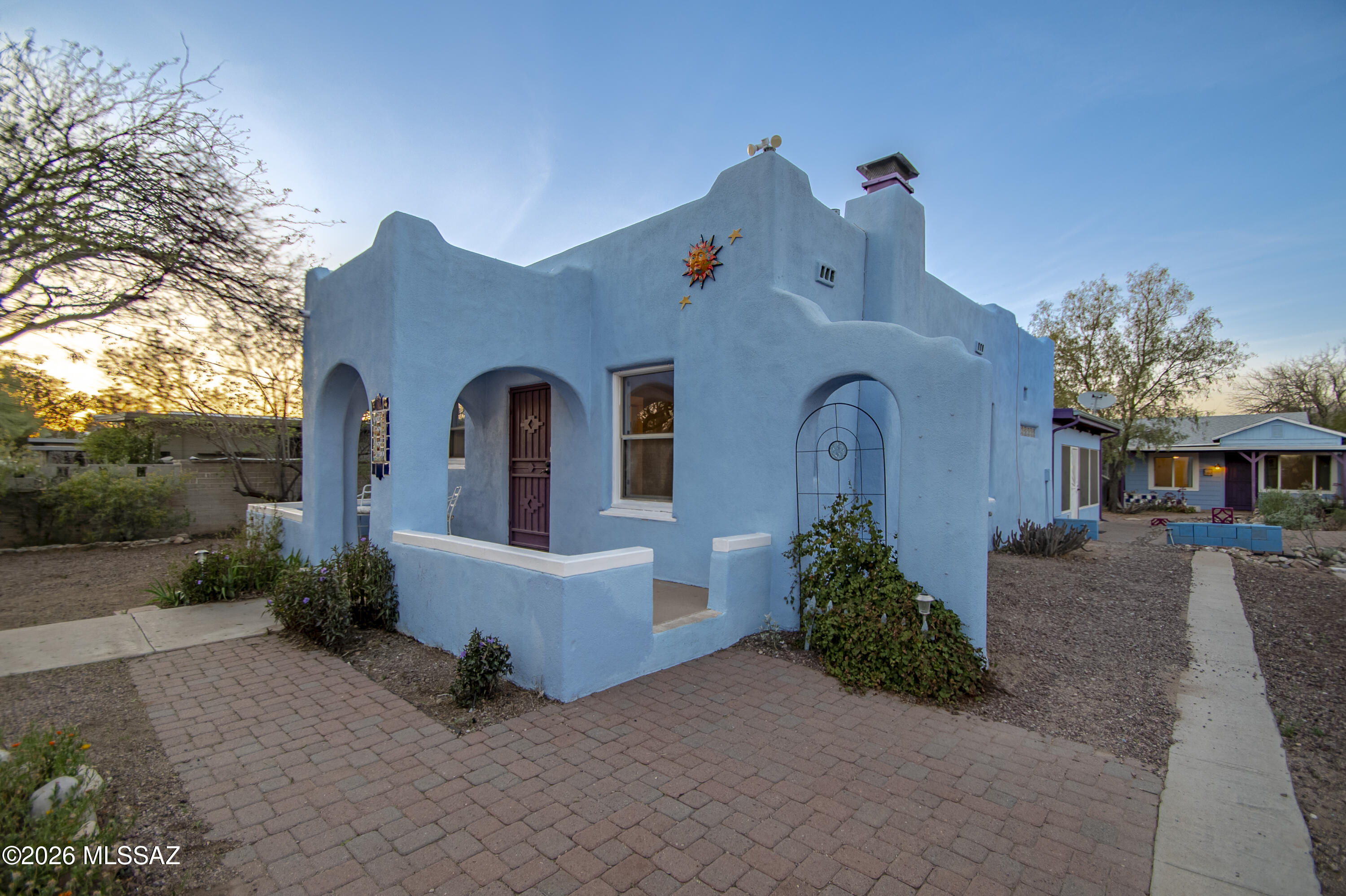 If you're looking for a 1933 vibe and modern conveniences, be sure to pop by 3553 E Camden. This pueblo deco beauty has both style and substance. 2/2 Main House. Studio Guest House. Wood Floors. Historic built-in cabinetry in kitchen. The original living room has been opened up to make a large great room. Current owner added modern primary suite in 2007. Screened porch. Guest house is modest, but will do the job, whether for long term guests or as a rental. Ample workshop and lots of exterior storage. Rainwater Harvesting. Low water use plantings. Walk to Coffee Times and The Loft. Double-pane windows. New plumbing 2025. New hot water heater 2025. New appliances in 2024/2025. Call your agent for an appointment.