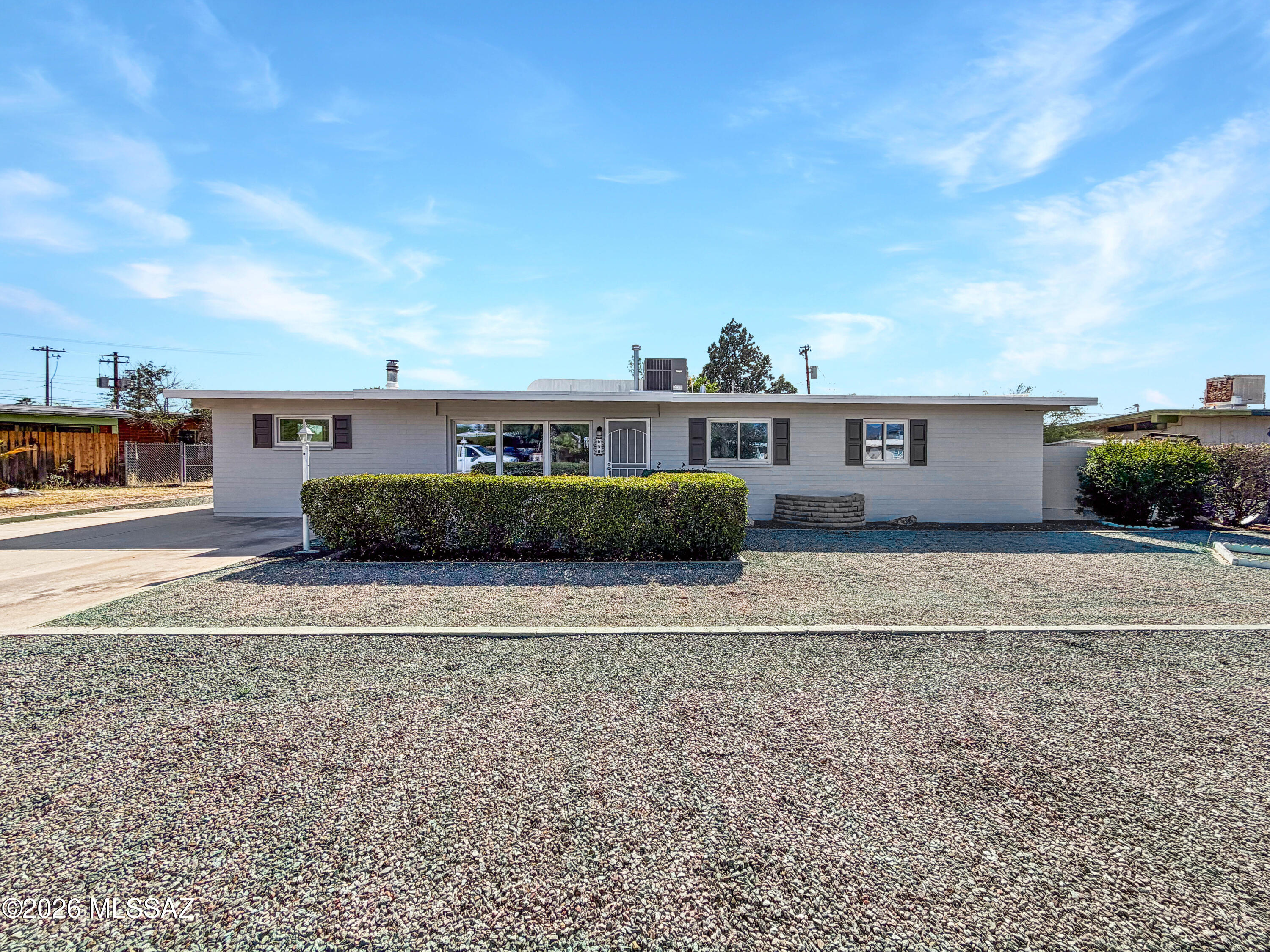 Meet 650 S Kenyon Dr, a residence recently enhanced with fresh interior paint, a partial flooring replacement, and fresh exterior paint, providing a crisp, updated aesthetic. The functional layout features a comfortable fireplace and a kitchen well-appointed with all stainless steel appliances. An inviting covered patio provides outdoor space, extending to a fully fenced in backyard for added utility. This updated property provides both modern appeal and comfortable living. Included 100-Day Home Warranty with buyer activation