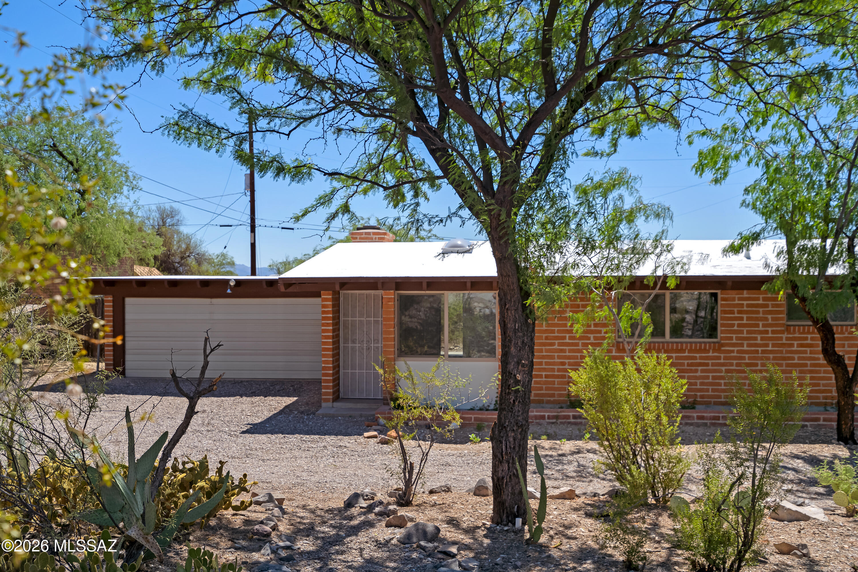 There's a saying here in Tucson that goes ''I love a good, old, brick home.'' Here's that home.

Welcome to your 1961 adobe charmer.