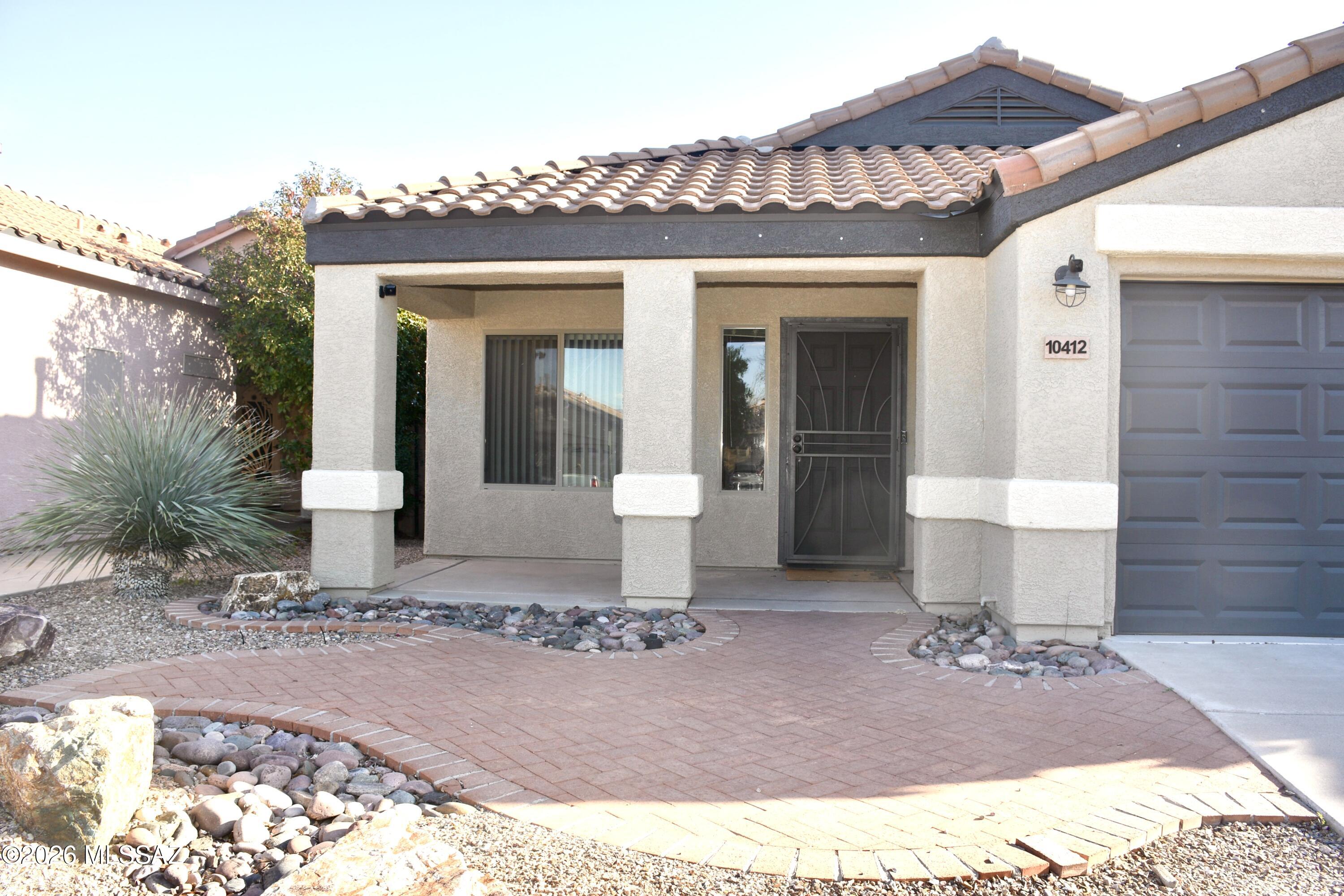 Incredible opportunity and an incredible home in Mesquite Ranch.  This 4-bedroom home has been completely updated.  New tile except in secondary bedrooms, new quartz countertops and stainless appliances. This home is in the Vail School District and there is a Community Pool for those hot days of summer. 2 car garage, AC, large backyard and washer dryer. Call today for a viewing.
