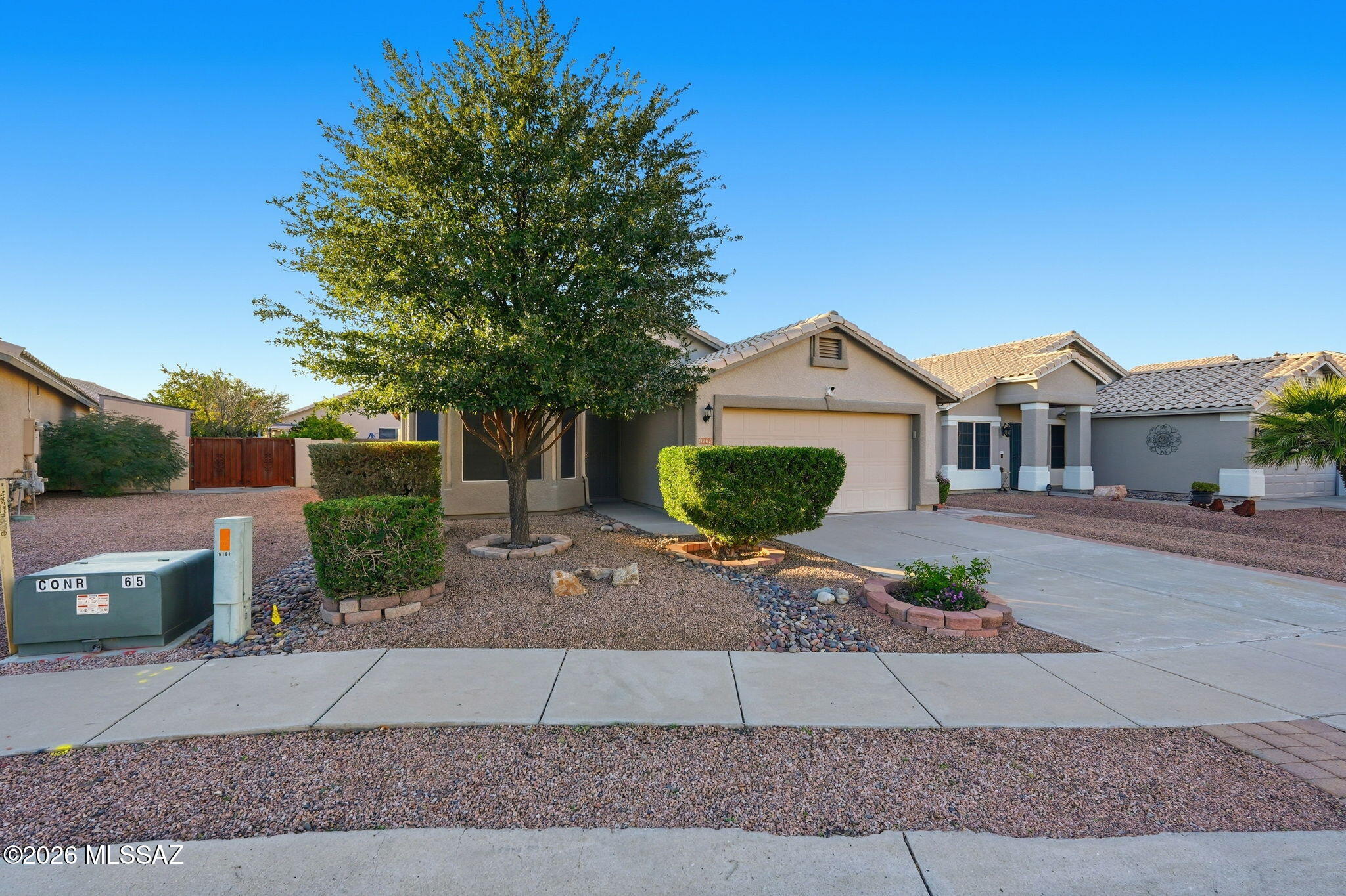 The house is located in the highly desirable Continental Ranch Community. It has a 3-bedroom, 2-bathroom home with a new roof, HVAC 2020, and two security cameras. The property offers a bright, functional floor plan and a covered back patio with fruit trees. The HOA Amenities has access to two community pools, athletic facilities, and basketball courts. Continental Ranch connects to the 137-mile bike loop in Tucson. Conveniently located near shopping, restaurants, parks, and freeway access.
