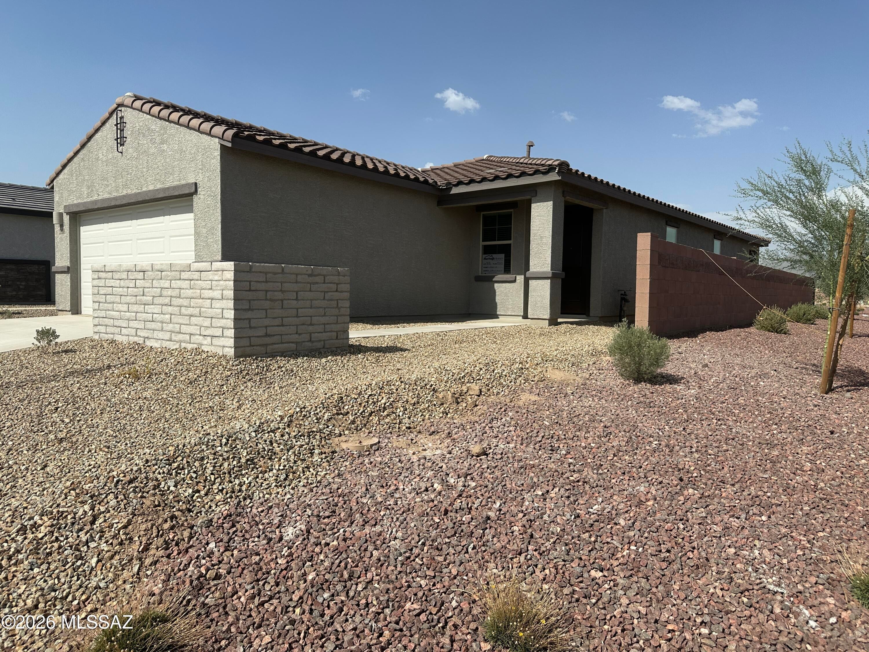 BRAND NEW BUILD! 3 Bedroom, 2 Bath House in Marana master-planned community that will feature amenities such as a swimming pool, pickleball courts, playgrounds, dog park and more. NEW everything and the new tenant will be to the first to live in this open-concept layout perfect for entertaining and everyday living. A versatile flex room just off the kitchen provides the ideal space for a home office, playroom, or hobby area. AC cooling. Ceramic tile in the living areas and flex room and carpet in the living rooms. The fully equipped kitchen has stainless appliances (gas stove, refrigerator, dishwasher, and microwave) and an island with breakfast bar. Both bathrooms enjoy double vanities and the primary bathroom has a step-in shower and the other has a tub/shower combo. This home also enjoys a laundry room with a washer and dryer included, 2-car garage, and a covered back porch that leads to a walled backyard.

Tenant pays all utilities.
Pets allowed with a $1000 pet deposit plus $50/month pet rent per pet.
Tenant must adhere to the Mandarina Community Assn. (HOA) rules & regulations.