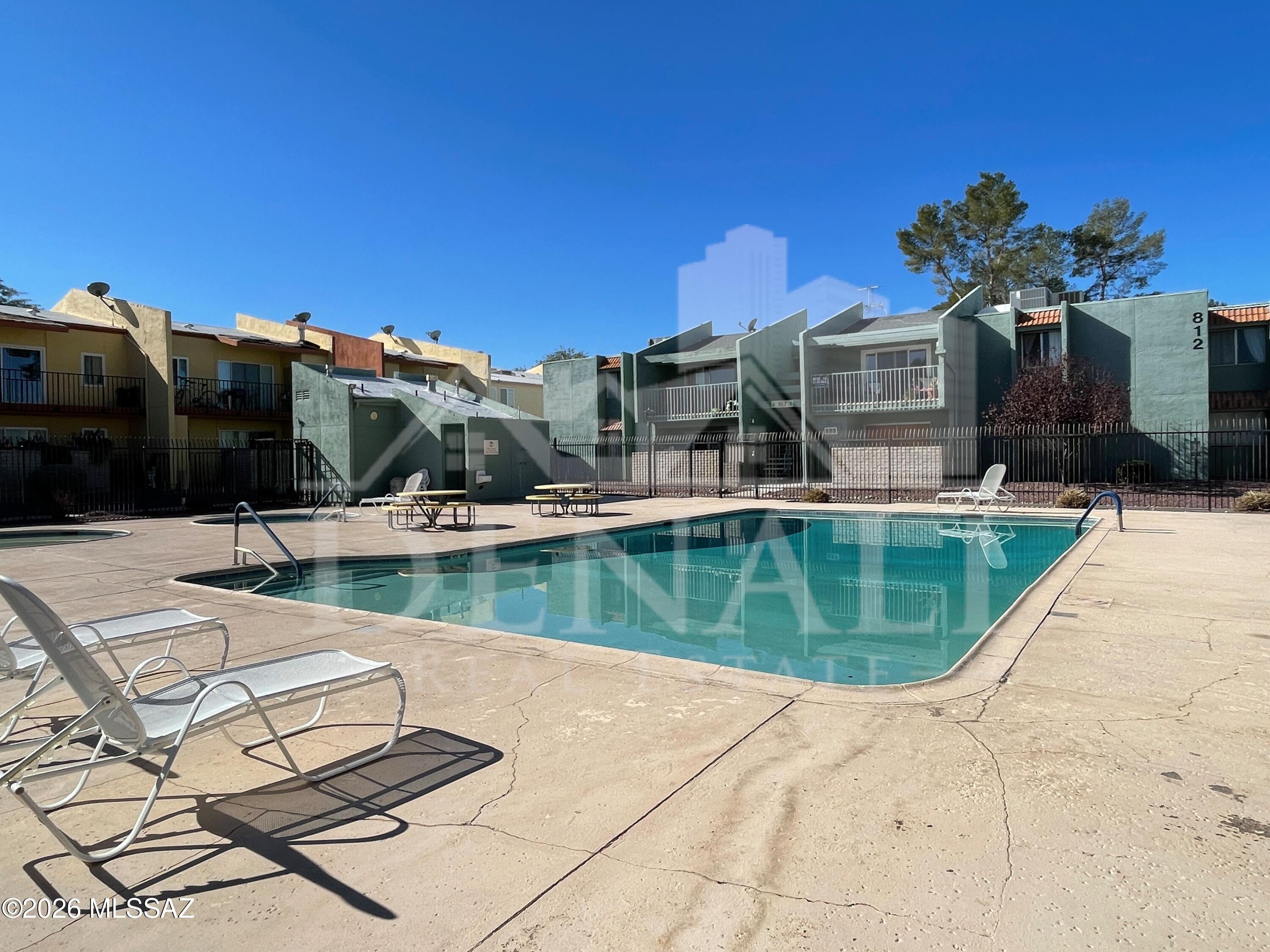 No Application Fees! Updated 2-bedroom, 2-bathroom second floor Tucson condo located in Langley Gardens offering a bright layout with vaulted ceilings and a private balcony. The interior features tile flooring throughout with newer carpeting in select areas, complemented by neutral paint and ceiling fans in each room. The living room opens directly to an extended private balcony and flows into the dining area, creating an open and functional layout. The kitchen has been upgraded with granite countertops, soft close cabinetry, gas range, stove top microwave, dishwasher, and refrigerator. The primary suite includes a walk-in closet, double sink vanity, and a tiled shower. A stackable washing machine and dryer are included for added convenience. Langley Gardens Condominiums is located in East Tucson near 22nd Street and Kolb Road, offering access to a community pool, spa, and separate children's pool along with nearby playground areas. The location provides convenient access to shopping, dining, and everyday services throughout East Tucson, along with nearby parks and established residential neighborhoods.

All Denali Real Estate residents are automatically enrolled in the Resident Benefits Package (RBP) for $55.00/month which includes Renter's Liability Insurance, Credit Building to help boost the resident's credit scores with timely rent payments, up to $1M Identity Theft Protection, HVAC air filter delivery (for applicable properties), our best-in-class resident rewards program, and much more! Pet Friendly property.