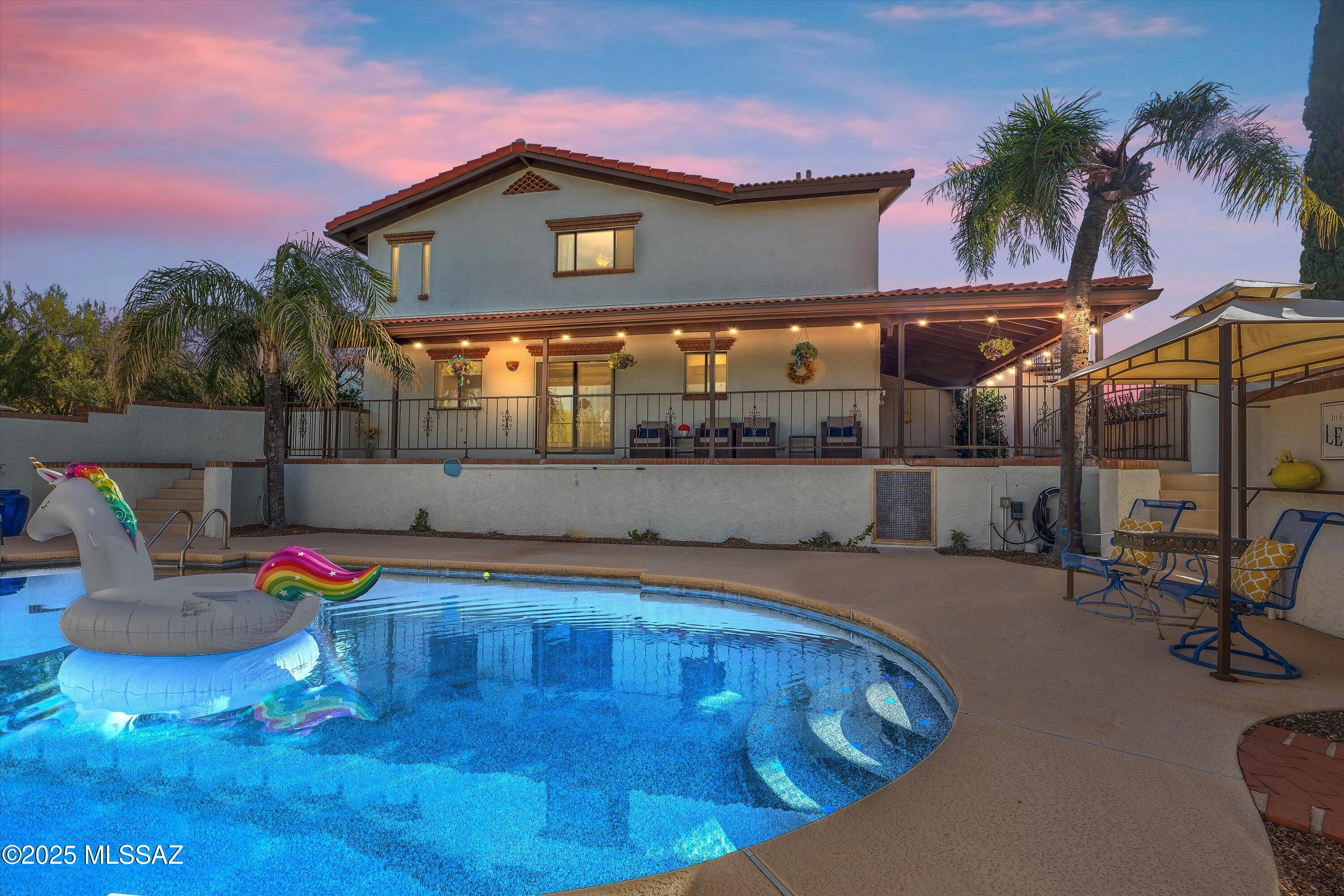 Remarkable Spanish-Style Retreat in the Heart of the Catalina Foothills 
Warm, inviting, and  one-of-a-kind.
Welcome to your stunning Tucson retreat, tucked away in a peaceful and private neighborhood in the prestigious Catalina Foothills. Set on just under an acre, this charming Spanish-style home is surrounded by mountain views, lush gardens, and timeless Tucson character. Its location is  unmatched—minutes to BASIS Tucson North (the #1 high school in the country), TMC for exceptional medical care, Whole Foods, Orangetheory, and some of Tucson's most beloved dining options and so much more! Outdoor enthusiasts will love being moments from Finger Rock Trail, Sabino Canyon, plenty of golf options, and the Loop, a paved multi-use path stretching more than 110 miles across the city. From the moment you arrive, this Tucson treasure feels like something you can unwrap just in time for the holidays. A spacious rose-lined courtyard welcomes you through decorative iron gates, setting the tone for the unique beauty found throughout the property.
Inside, the home is filled with warmth and elegance. The grand entrance showcases a striking stone staircase, rich wood coffered ceiling, and artistic mosaic tilework that continues throughout both the interior and exterior, each detail adding depth and charm. The expansive living areas include multiple wood-burning fireplaces, offering cozy spaces to gather and unwind. A stunning brick fireplace centers the primary bedroom, creating a retreat that glows with character.
The heart of the home features an open family living area with a wet bar and seamless access to the outdoor kitchen, perfect for indoor/outdoor entertaining. From your kitchen window, enjoy views of your resort style backyard featuring a sparkling PebbleTec pool, complete with newer equipment and a newer spa nearby. A long covered patio stretches the length of the home, leading to a wood-burning outdoor fireplace, an outdoor kitchen, and beautifully landscaped grounds designed for an easygoing Tucson outdoor lifestyle.
One of the home's most notable features is the spacious guest quarters, offering privacy and comfort with its own separate entrance, living room, bedroom, walk-in closet, and full bathideal for multigenerational living, long-term guests, or a luxurious work-from-home suite.
An expansive rooftop terrace captures mountain views, cotton-candy sunsets, and even Fourth of July fireworks, a breathtaking space for morning coffee or peaceful evening stargazing.

Additional highlights include:
-4 car tendem garage with storage room 
-Newer HVAC systems (2)
-Central vac system
-Extended driveway for additional parking
-Patina-finished garage door that elevate the home's Spanish charm

This home is a rare find, warm, elegant, unique, and designed for effortless desert living. A true Tucson gem in one of the city's most coveted locations.