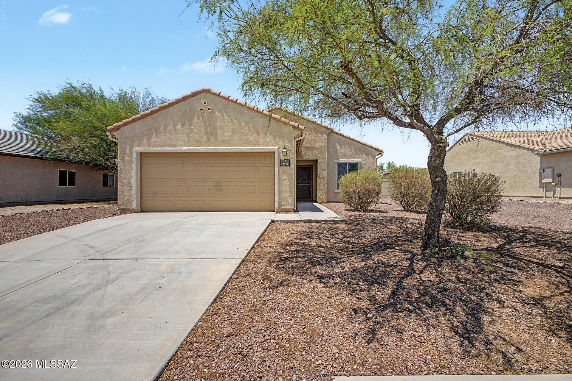 This charming single-story home is ready to bring you joy! This gem boasts a great curb appeal, an easy-maintenance landscape, and a 2-car garage. Inside, you'll be greeted by a spacious living room perfect for entertaining, with carpeting underfoot, abundant natural light, and neutral paint that pairs well with any decor. The kitchen awaits your culinary adventures, equipped with ample cabinetry adorned with crown molding, a two-tiered peninsula, and SS appliances. The owner's suite offers a practical walk-in closet and a bathroom with double sinks for added comfort. The sizable backyard includes a covered patio perfect for relaxing with your favorite drink and ample space for outdoor fun, ready for your personal touch. Make it yours now! Agent/Owner