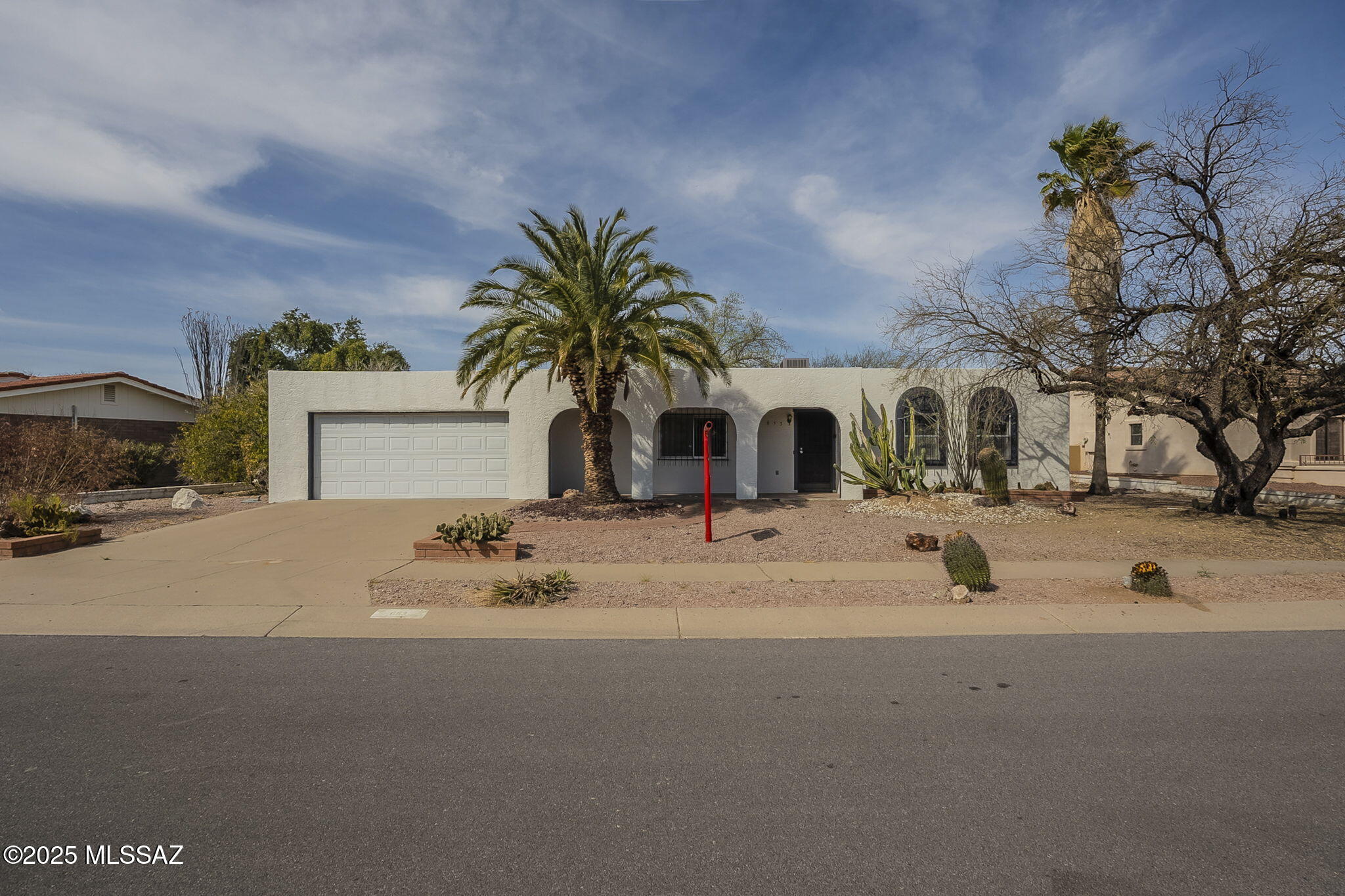 Welcome to your Southwestern sanctuary in Green Valley Country Club Vistas! This freshly painted 2-bedroom, 2-bath, 1525 sq. ft. home offers a perfect blend of style and comfort. The updated kitchen has new cabinets and countertops, while the inviting living room features a cozy wood-burning fireplace. The primary bathroom showcases ceramic tile finishes with practical elegance. There's also a bonus room off the back of the garage perfect for a hobby room, an office or anything you can imagine. Step outside to enjoy the 0.22-acre lot with low-maintenance desert landscaping and a covered patio. This home is an idyllic retreat for relaxation and leisure.