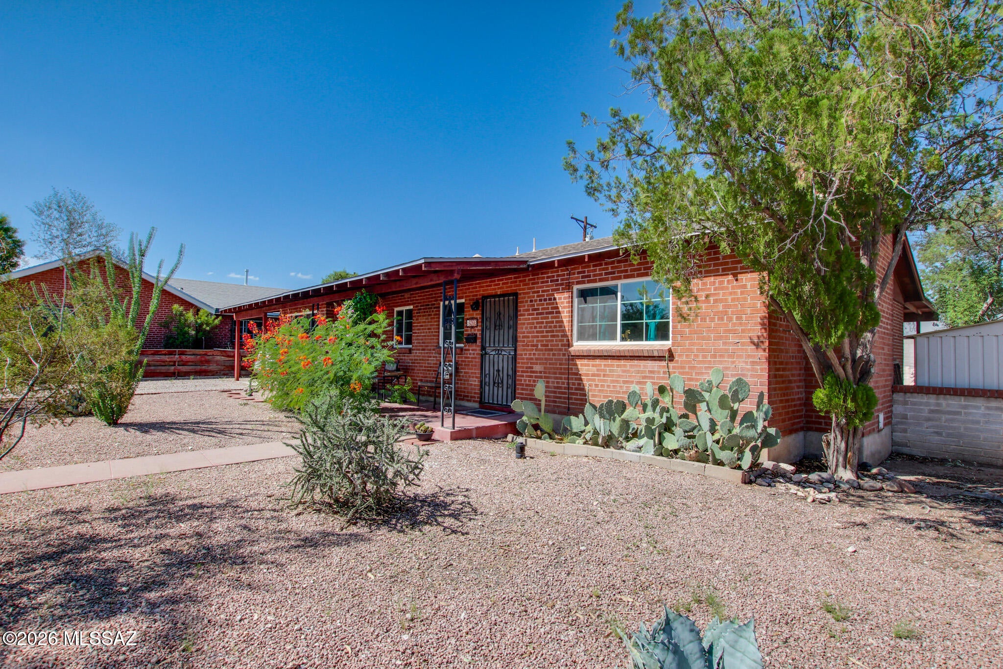 This 3-bedroom, 2-bathroom mid-century brick residence offers a fully updated, low-maintenance turnkey living experience. The interior features concrete floors and a wood-burning fireplace, while the entire property benefits from major recent infrastructure updates. These include brand-new plumbing (2026), a new HVAC and water heater (2025), a new roof (2023), and noise-reducing Energy Star windows (2021). Located in the heart of town, the home provides exceptional proximity to the University of Arizona, Banner Hospital, freeway transit, and daily shopping conveniences.