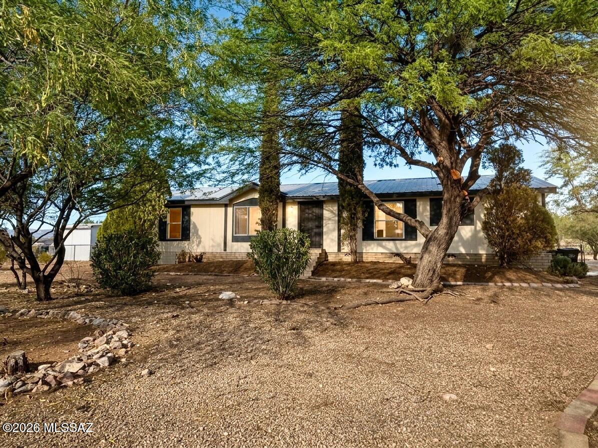 Bring your horses, RVs, trailers, and toys! This 3BR/2BA home sits on a full acre with NO HOA restrictions and horse-friendly zoning! 

Enjoy mountain views and Arizona sunsets from the large living room window, plus a fully fenced yard with room to roam. Inside, you'll find abundant natural light, skylights, an open kitchen with extensive cabinet storage, and a bonus room off the primary suite perfect for an office, nursery, gym, or hobby space. 

Enjoy peace of mind with major updates already done including metal roof (2022), HVAC (2022), brand new water heater (2026), remodeled primary bath (2024), kitchen sink (2024), exterior paint (2026) and added backyard gravel. Septic system means no monthly sewer bill. 

Affordable acreage living with freedom, space, and endless possibiliti
