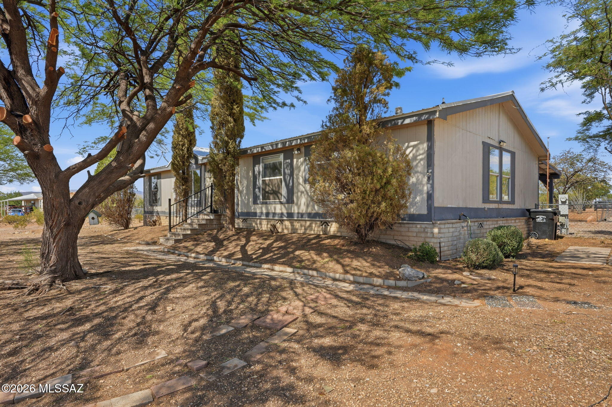 Bring your horses, RVs, trailers, and toys! This 3BR/2BA home sits on a full acre with NO HOA restrictions and horse-friendly zoning! 

Enjoy mountain views and Arizona sunsets from the large living room window, plus a fully fenced yard with room to roam. Inside, you'll find abundant natural light, skylights, an open kitchen with extensive cabinet storage, and a bonus room off the primary suite perfect for an office, nursery, gym, or hobby space. 

Enjoy peace of mind with major updates already done including newer roof (2022), HVAC (2022), brand new water heater (2026), remodeled primary bath (2024), kitchen sink (2024), and added backyard gravel. Septic system means no monthly sewer bill. 

Affordable acreage living with freedom, space, and endless possibilities!