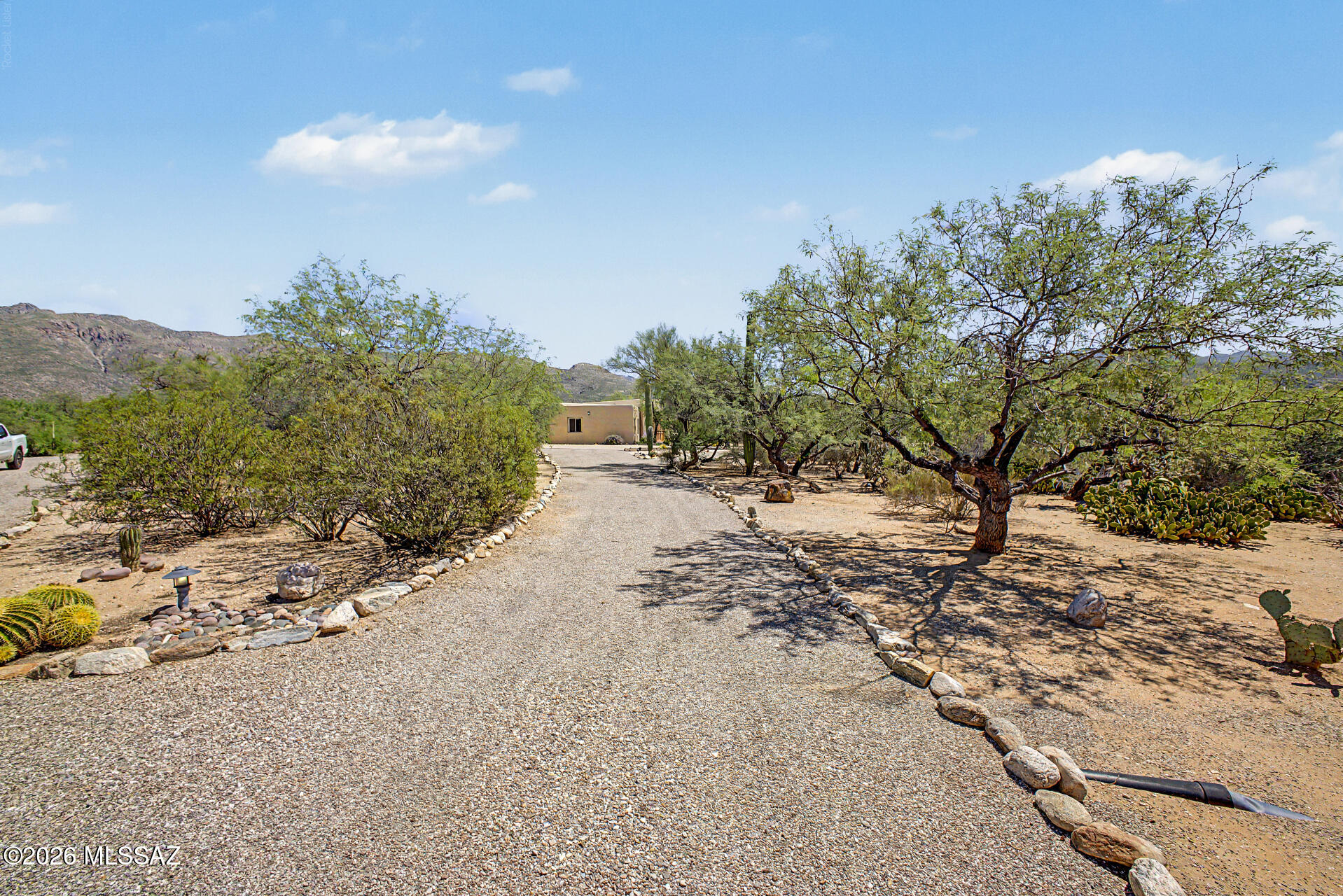 Beautiful custom home nestled in the heart of Tanque Verde Valley. Open, bright and spacious, this 4 bed, 2 1/2 bath, 3,014 sq ft home has it all.  5.78 acres of private land, w/ no HOA, allows space for every need. Large interior gathering areas with oversized windows overlook the unobstructed mountain views and lush desert landscaping. Enjoy peace and quiet on the large patio as the mountains turn pink at sunset.
Oversized 3 car garage, 2 full RV Hook ups and abundance of space for all vehicles & toys. Home is zoned for heating and cooling. A/C is new with 1 unit being installed 2 yrs ago and the other unit 2 months. You must walk thru this home to really appreciate. 

A portion of the acreage is in a flood plain but the home is not. Go to FEMA.gov/flood-maps