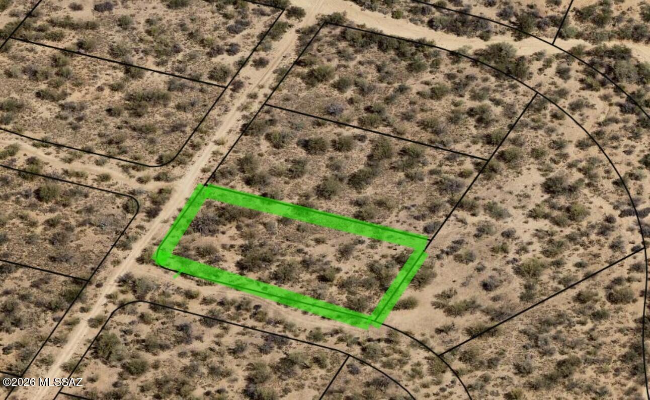 This 1.03 ac lot is 1 of 3 available, make offer on all 3. Possible Owner Carry. Secluded in the foothills of Sierrita Mountains this homesite offers breathtaking 360-degree mountain views and sunsets. Zoned CR-1 with no HOA, it's an ideal location to build your dream home and enjoy the freedom of country living. Horses are welcome, with access to numerous roads, washes, and thousands of acres of nearby State Land for riding and recreation. Located in the desirable Diamond Bell Ranch area, just 30 minutes from Tucson, this property offers excellent value and investment potential. At an elevation approx 3,275 feet, enjoy cooler temperatures and increased rainfall than many surrounding areas!  Need a 4 Wheel Dr to access it.
