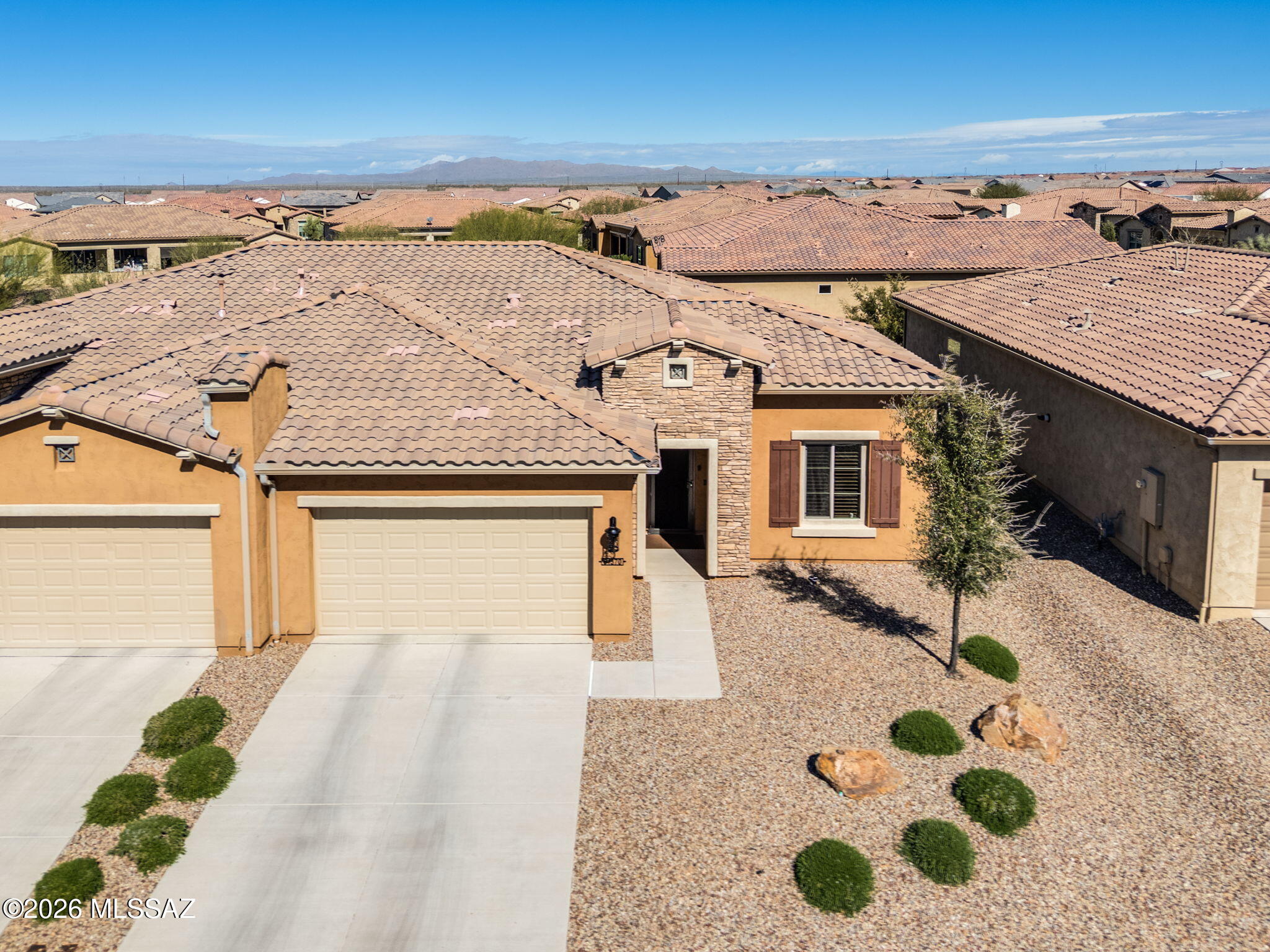 This north-south oriented Villa fills the home with natural light and helps keep it cool during the summer. Offering 2 bedrooms, 2 full baths plus 1,404 sq ft of luxury living space for your enjoyment. Recent updates include new kitchen cabinets and a remodeled master walk-in shower. The open concept interior features quartz countertops and vinyl plank (LVP) flooring throughout. It also has a surge protector and a water softener. A 65'' Sony TV and sound system are included. Security screen door. The brick-paved backyard patio has a turfed area, a snake gate, and offers a private desert view. The ''Lock and Leave'' concept is ideal for investors, seasonal residents, and frequent travelers. The Master HOA dues cover community amenities; the Villa assessment includes landscaping, painting, roof repairs, and pest control for those seeking hassle-free homeownership. SaddleBrooke Ranch Active Adult Community offers resort style amenities, panoramic mountain vistas and a tranquil setting in the high desert.