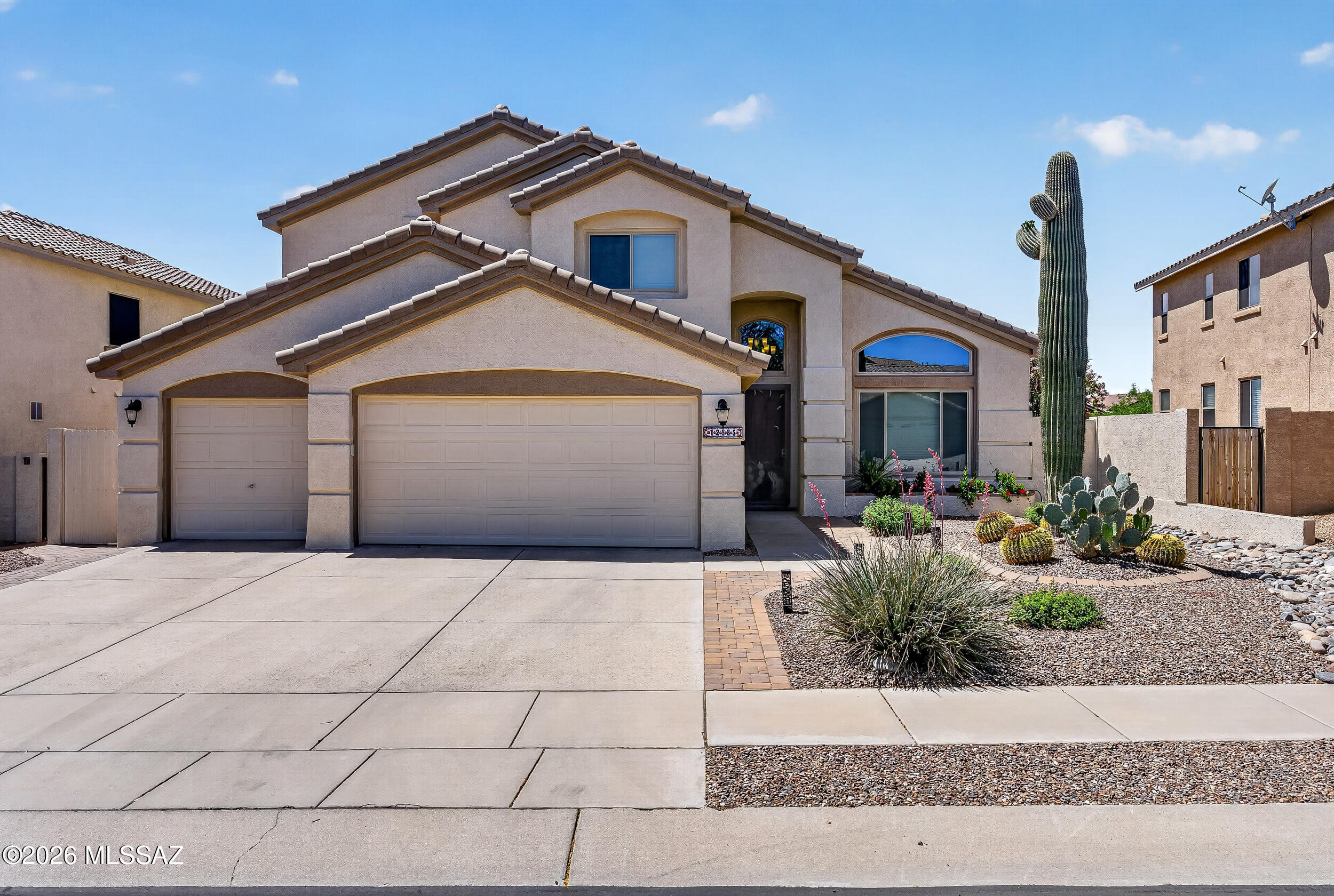 Stunning 4bd/3ba, 2,662 sq ft home on a PREMIUM LOT in Rancho Vistoso w/breathtaking mountain views, view fence & no immediate rear neighbors! OVER $90K in UPGRADES: fresh ext paint (2022), nearly all windows new in 2022 (~$20K), new Pella slider, upgraded wood-look tile flooring ($15.5K), new blinds/shades (~$3.9K), dual HVACs w/new downstairs Lennox 16 SEER (2020), duct cleaning, epoxy garage floor ($3.1K '23), NO POLY & more. Gourmet kitchen w/granite counters, breakfast bar, peninsula w/wine rack, SS appl (2021), farmhouse sink & tile backsplash. Lux primary suite w/dual vanities & spa shower. Heated pool & spa (retiled/resurfaced '21), retractable sun shades ($6.1K '23), artificial turf by Tucson Turf ('23), built-in BBQ & vast flagstone-look patio. Move-in ready! SEE UPGRADE SHEET!!!