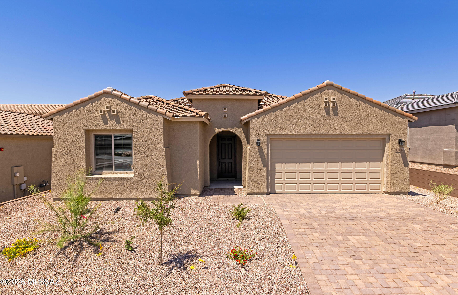 Brand-new home available for move-in April 2026. This thoughtfully designed split floor plan showcases a contemporary exterior with elegant driveway and walkway pavers. The interior features a chef-inspired kitchen with a gas cooktop, stainless steel Whirlpool appliances, Coastal Shaker paint-grade stone cabinetry, Bianco Aspen quartz countertops, and a custom backsplash.