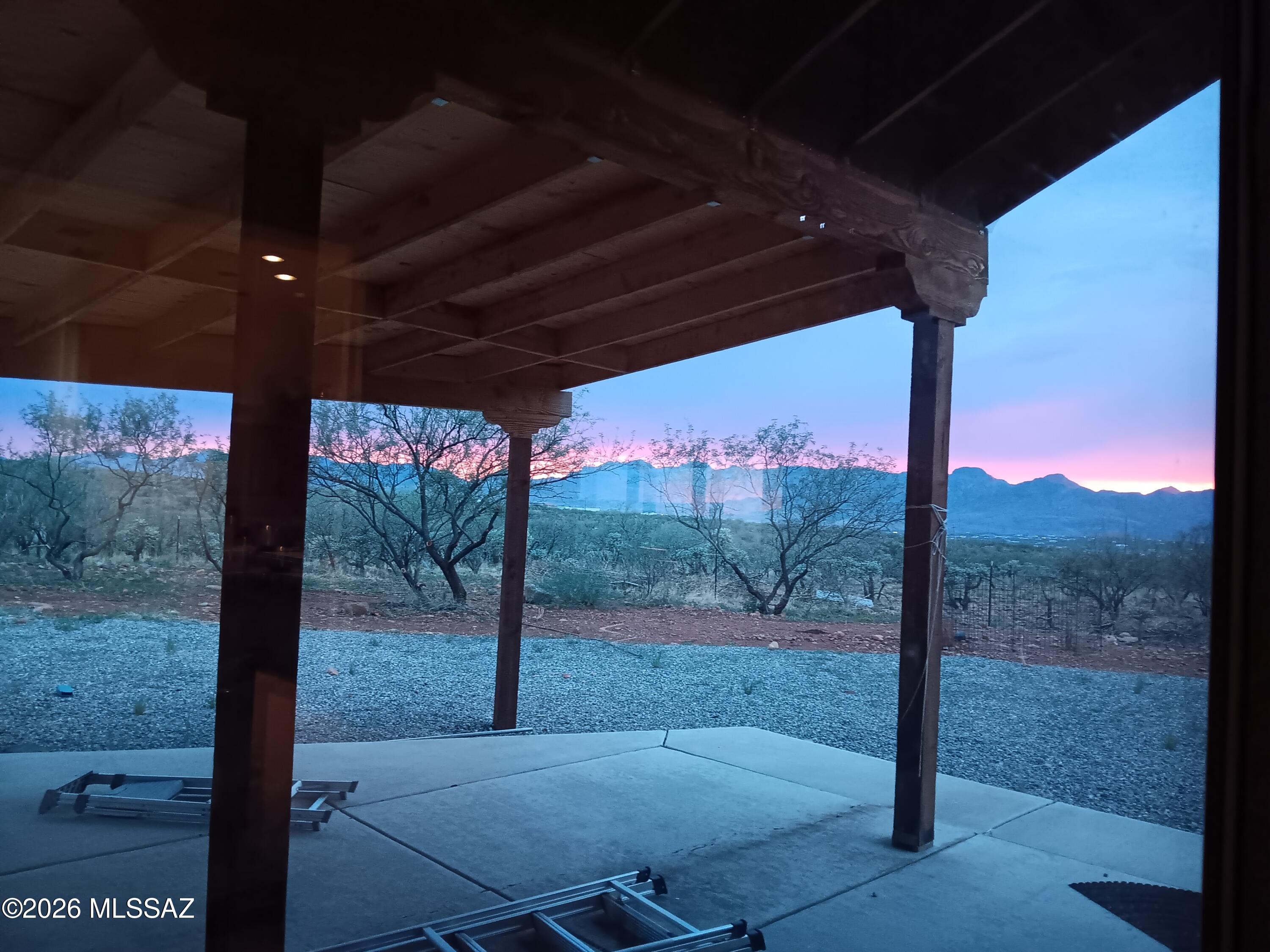 Stunning Panoramic views on 3 prime acres, 3 parcels &A casita, offering Santa Fe Style, custom built, total privacy & serenity with breath taking Sunsets & Sunrises. This immaculate home features soaring 10-12+ft ceilings for an open, spacious feel. Large master with a walk-in closet. Wood burning fireplace. Central A/C& mini-split 24K BTU. Laundry RM inside. A perfect blend of comfort &modern upgrades and jaw-dropping natural beauty,1673 SF & A detached casita 261 SF serves as the private 4th bedroom/guest suite with the 3rd full bath &closet & Spectacular Views-Ideal for visitors, family or extra income, with a separate entry. Whole house water purification &RO in kitchen. High-end blinds.
Relax on covered &Slabbed front & back patios.--Your private mountain escape awaits. East of  I-1