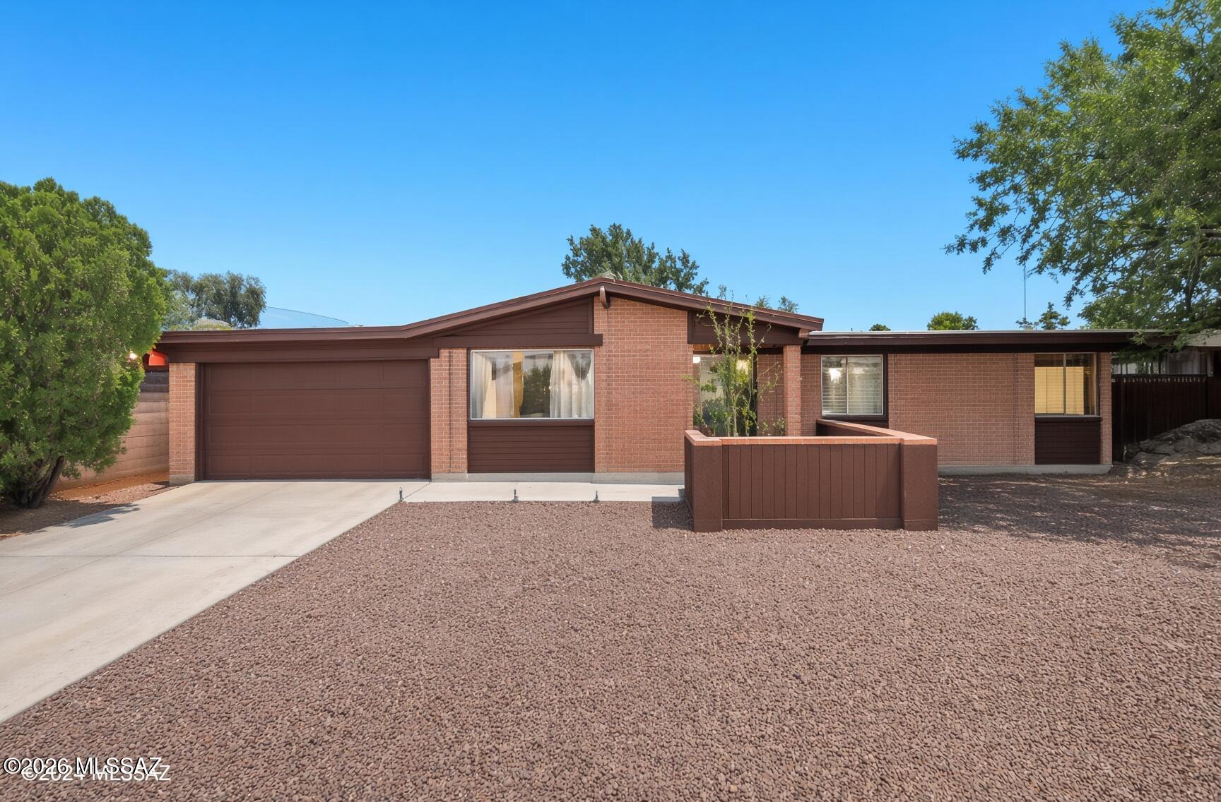 This move-in ready 4-bedroom, 2-bath home with an attached garage offers the perfect blend of comfort, space, and convenience. The flexible floor plan features a spacious living area, cozy den, and bonus room ideal for a home office, playroom, gym, or media room. Enjoy year-round comfort with central A/C, abundant storage, and stylish updates throughout. Situated on a large corner lot, the oversized backyard offers endless possibilities for entertaining, gardening, pets, or outdoor living. Conveniently located near The Loop, Fantasy Island Mountain Bike Park, shopping, dining, schools, major employers, and easy commuter access. This is a  fantastic opportunity to own this nice home.