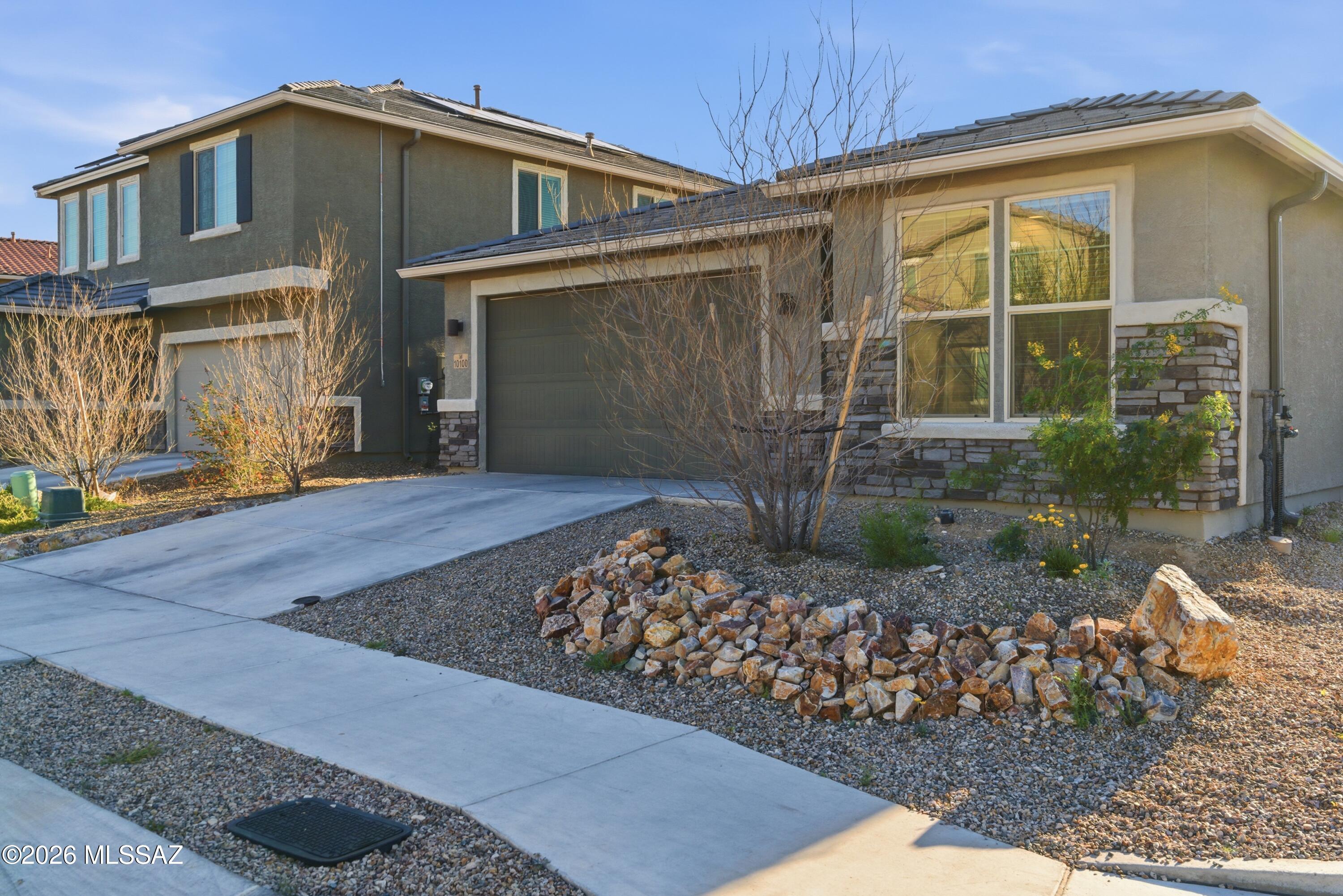 4.75% FHA Assumable Loan - $342K Approximate Balance! Rare Opportunity! Beautiful 4-bedroom, 2-bath home plus a versatile den/office on a premium corner lot in Rancho del Lago within the Vail School District! This lightly lived-in 2022 Richmond American property offers a bright open great room with 9-foot ceilings flowing into a spacious kitchen featuring quartz countertops, a large island, and walk-in pantry, perfect for entertaining or everyday living. The private primary suite includes two walk-in closets and an attached bath. Enjoy the low-maintenance backyard with turf, decorative gravel, fire pit, and covered patio, ideal for relaxing and taking in Arizona sunsets. Conveniently located near Rancho del Lago Golf Club, parks, shopping, and schools. Come see this beautiful home today!