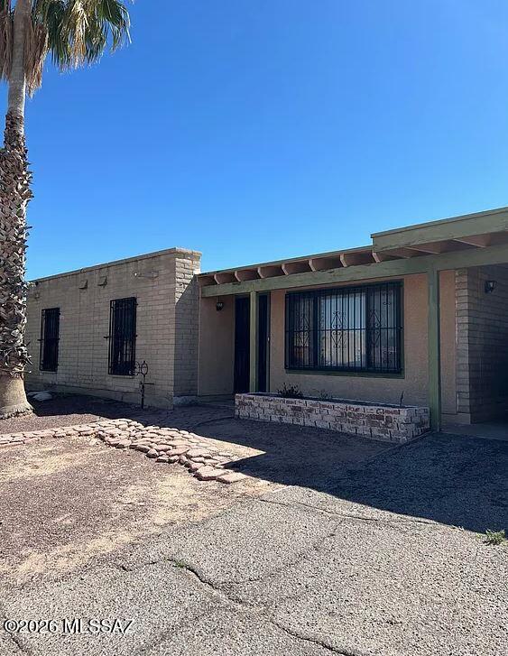 Spacious 4 bedroom, 2 bathroom home offering 1,377 sq. ft. of comfortable living space in south Tucson, conveniently located just down the street from Sunnyside High School. This home features tile and wood laminate flooring throughout with no carpet, creating a clean and low-maintenance interior. The large open kitchen is perfect for everyday living and entertaining, complete with a refrigerator, stove, oven, microwave, dishwasher, and disposal. Enjoy year-round comfort with air conditioning, ceiling fans, and heating. Additional features include washer and dryer hookups, window coverings, a covered carport, and a private fenced yard with plenty of outdoor space. Conveniently located near schools, parks, shopping, and major roadways, this is a pet-friendly home.
