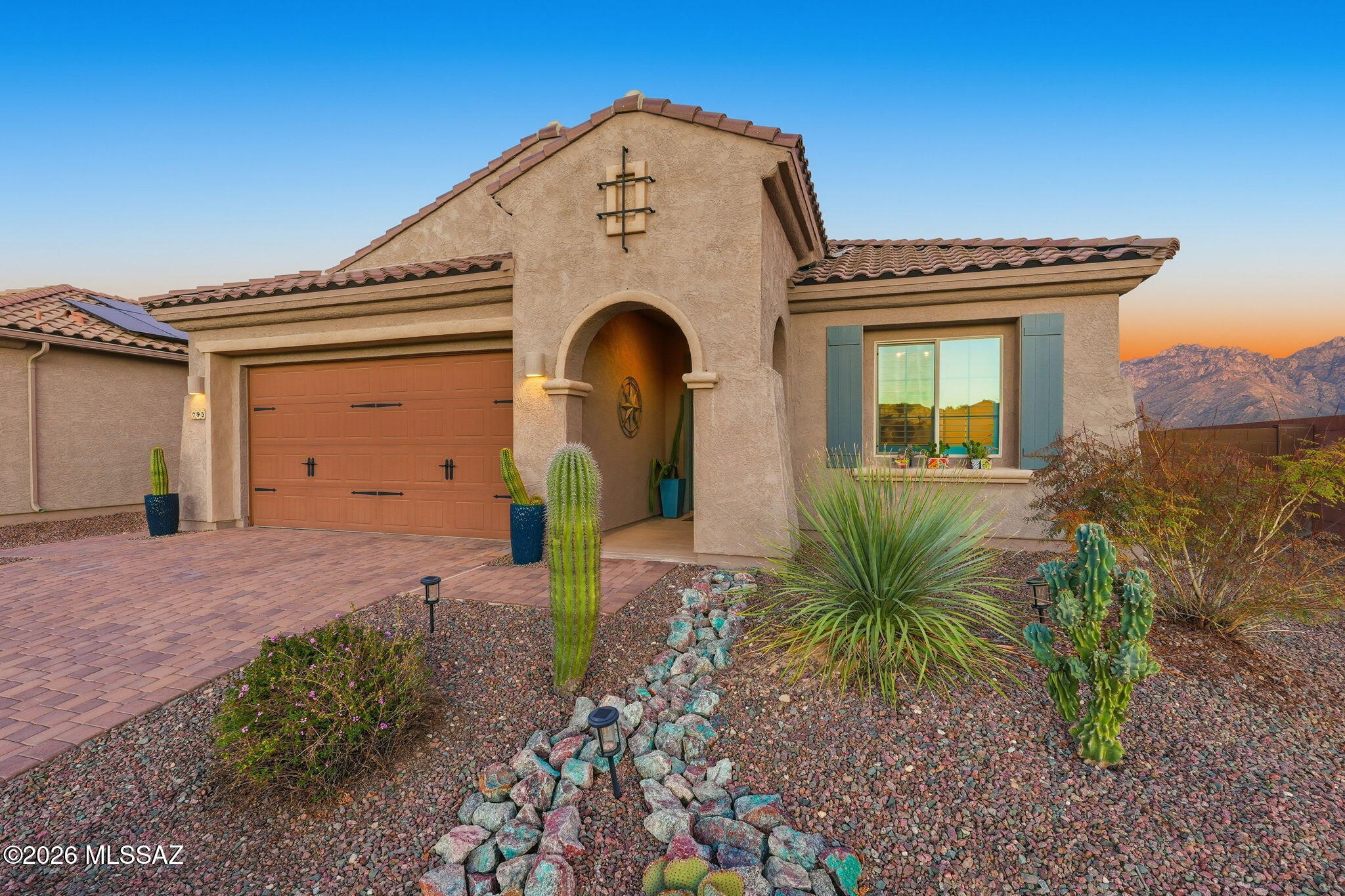 Welcome to your Oro Valley oasis! This model-quality home has many desirable upgrades! It is a palette waiting for your personal touches. The gourmet kitchen has plenty of cabinets, beautiful quartz countertops & walk-in pantry. You will appreciate breathtaking views from the kitchen & great room through the enormous sliding patio door, which opens to the backyard, perfect for everyday living and entertainment. Enjoy cooking at your built-in barbecue & bar, relaxing on your patio, or unwinding under your solar-lit gazebo with a built-in gas fireplace. The owners' suite has a walk-in closet and a spa-like shower. Other bonuses include an extended garage with overhead storage, a water softener, remote rolling shutters on the slider, and patio. This is a must-see property!