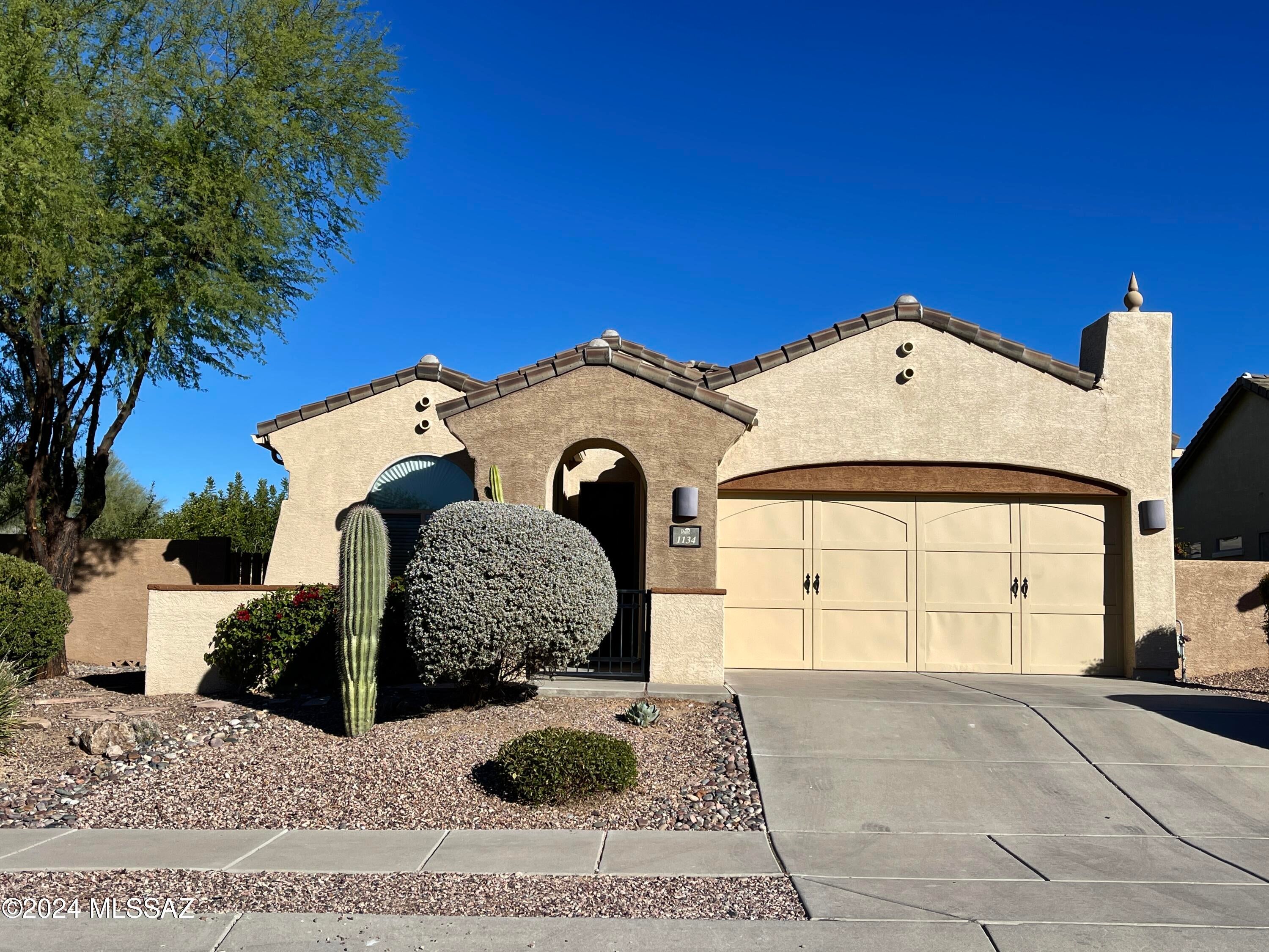 Beautiful 3bdr/2ba w/Den in Oro Valley! Enjoy morning coffee in the gated courtyard w/mountain views, spacious foyer w/styled design, Den has French doors for added privacy, kitchen features tons of cabinet/counter space, spacious primary bedroom w/patio access, Greatroom offers a gas fireplace and overlooks the backyard garden. Relax on the covered patio w/added dining area on the side. Raised beds over an area for those with a green thumb!
