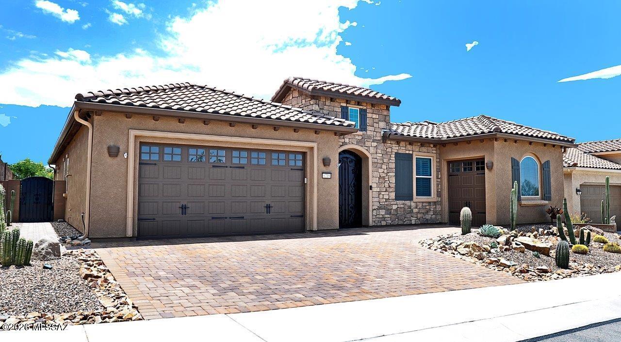 Stunning Journey model floorplan in Del Webb at Dove Mountain with Galley Golf Course behind!  Being sold FURNISHED!  Lots of upgrades/updated in recent months.  New installed 20x30 inch tile throughout.  New quartz and tile accents in kitchen, new quartz in primary bath and new vanity and tile in powder room.  New courtyard gate and fountain, new pavers in driveway, new pergola extension and extensive landscape updating.