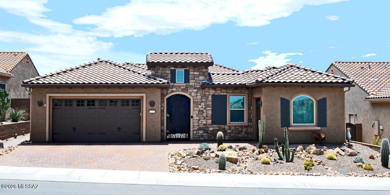 Stunning Journey model floorplan in Del Webb at Dove Mountain! Can be sold FULLY FURNISHED!  Lots of upgrades/updated in recent months.  New installed 20x30 inch tile throughout.  New quartz and tile accents in kitchen, new quartz in primary bath and new vanity and tile in powder room.  New courtyard gate and fountain, new pavers in driveway, new pergola extension and extensive landscape updating.