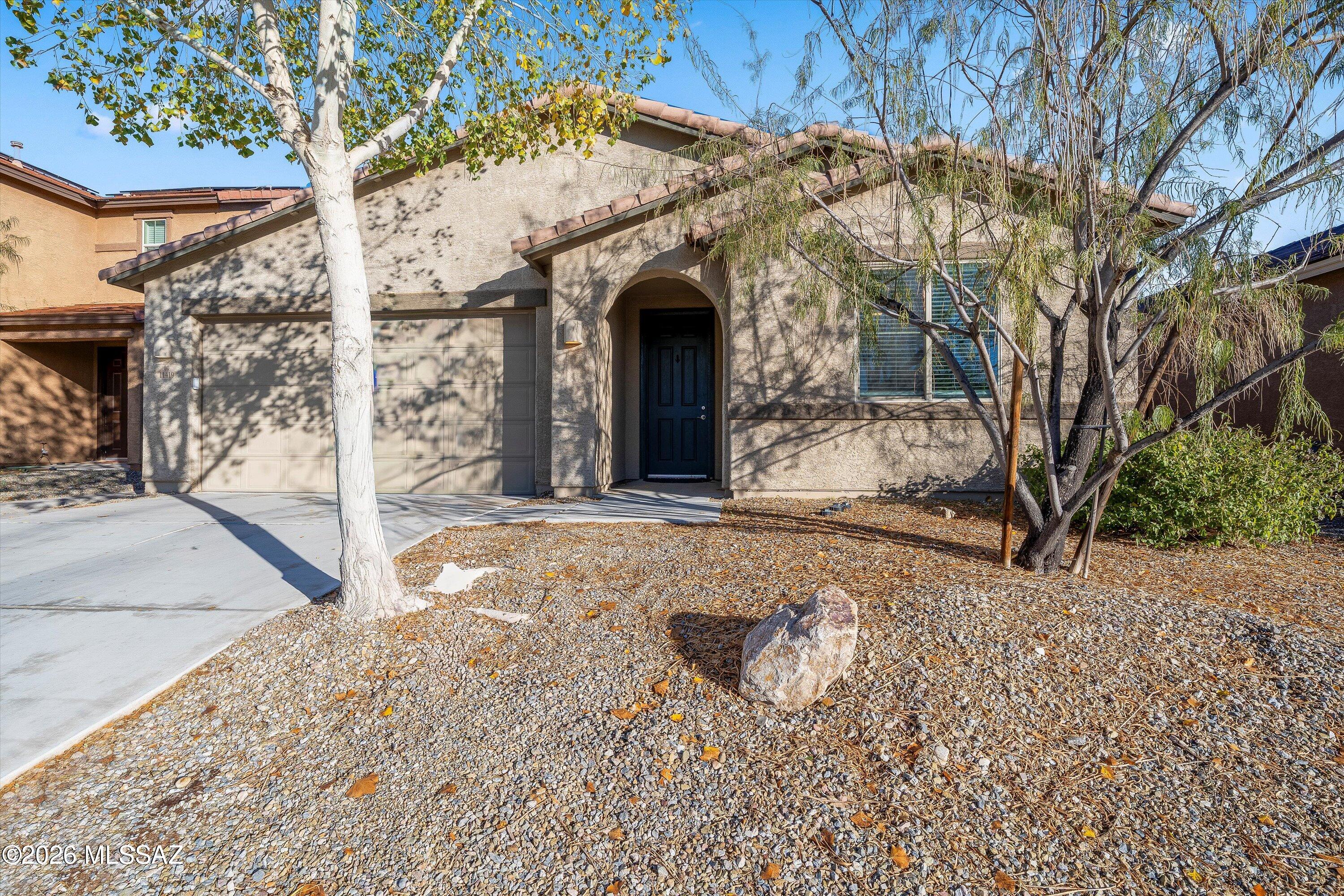 Welcome to this stunning, move-in-ready 3-bedroom plus den (easily a 4th bedroom) home in the highly desirable Mountain Vail Estates subdivision. Step inside to an expansive great room bathed in natural light, featuring high 9-foot ceilings and sleek tile flooring. The chef-inspired kitchen is a showstopper with its oversized granite center island, stainless steel appliances, and walk-in pantry.

The split-bedroom floor plan ensures privacy, leading to a spacious primary suite complete with a dual-vanity, huge walk-in shower and a generous walk-in closet. Outside, enjoy the Arizona lifestyle in your low-maintenance backyard, featuring a huge covered patio with a built-in barbecue. Located just minutes from I-10 shopping at Houghton Rd.
The property does have solar that is being purchase