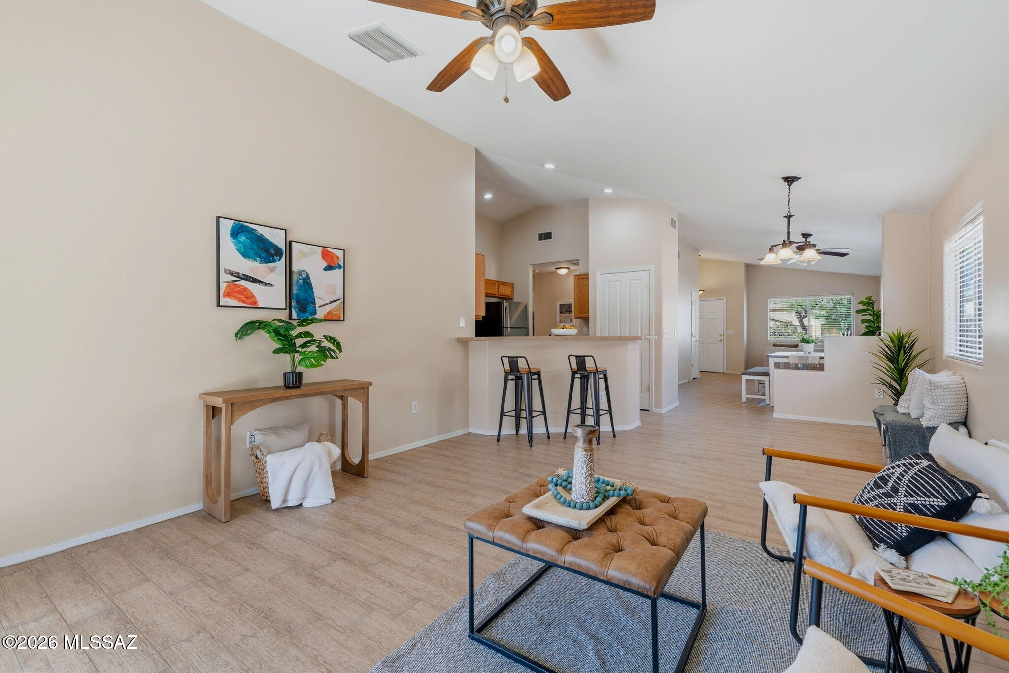 Discover this well-cared-for, move-in-ready home in Valencia Reserve! Built in 2007, this contemporary single-level residence offers 1,514 sq. ft. of light, bright, and airy living space, featuring three bedrooms and two bathrooms. The inviting interior showcases a tile roof, attractive wood-look tile flooring, and comfortable carpeted bedrooms. The spacious primary suite provides a relaxing retreat, while the desirable north-south orientation adds to the home's appeal. The backyard features artificial turf and offers an opportunity to bring your imagination to life by creating an expanded outdoor living and entertaining space tailored to your lifestyle. Conveniently located near Raytheon, Tucson International Airport, Amazon fulfillment and distribution centers, and other major employers, with easy access to both Interstate 10 and Interstate 19. This home offers exceptional value and an outstanding opportunity to enjoy comfortable living in a convenient Valencia Reserve location!