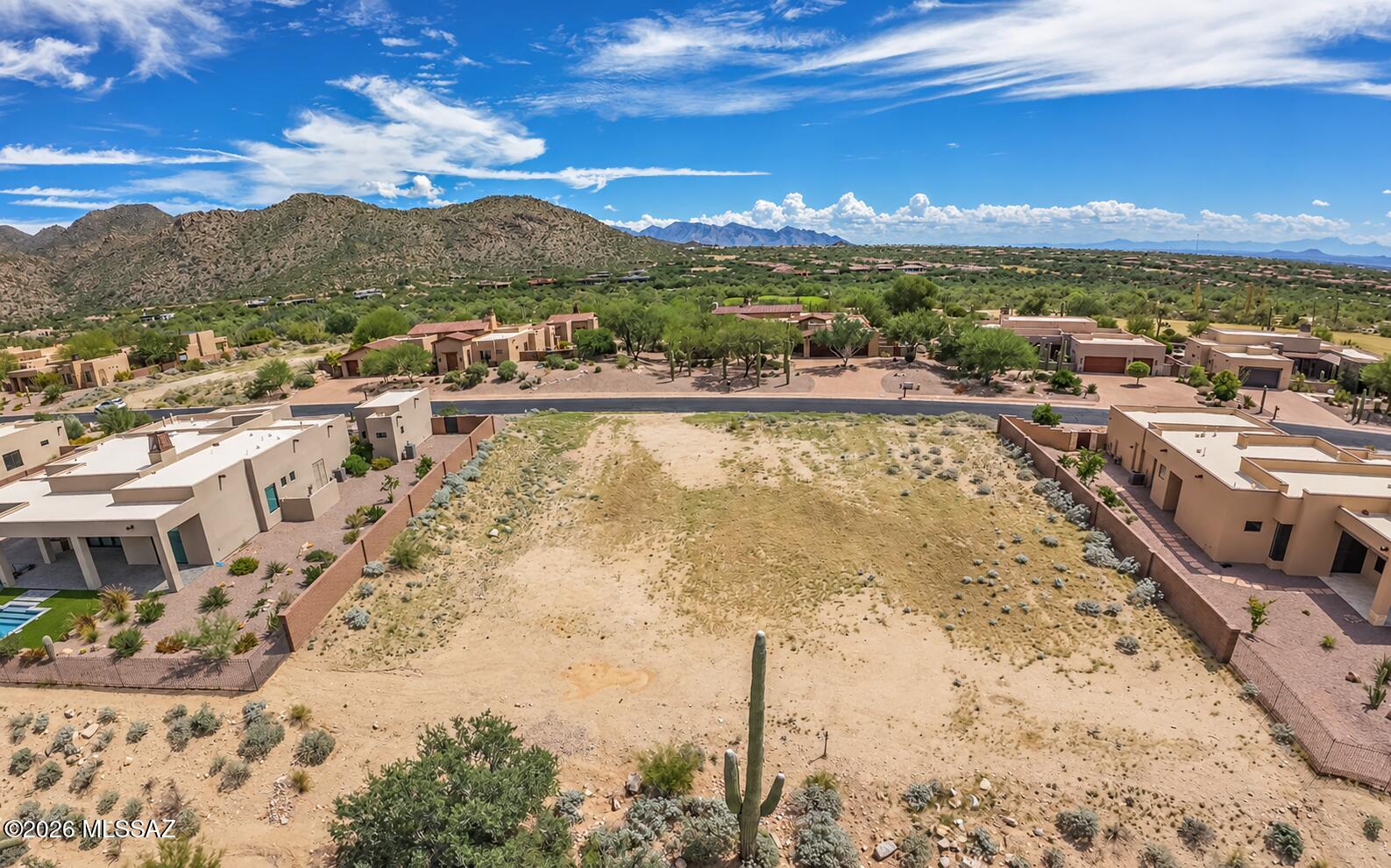 A rare custom lot re-sale opportunity located at The Ritz-Carlton Residences - Seven Saguaros, Dove Mountain. This luxury community hosts some of the most beautiful custom homes in Dove Mountain. The Ritz-Carlton Dove Mountain is nestled into the Tortolita Mountains and provides a beautiful backdrop for all these custom homes and homesites. Owners have access to concierge services, amenities, social events and more (which are subject to change). All owners are also members at The Golf Club at Dove Mountain. For more information regarding initiation fees and monthly dues please contact the Director of Memberships, Emily Bloom.
