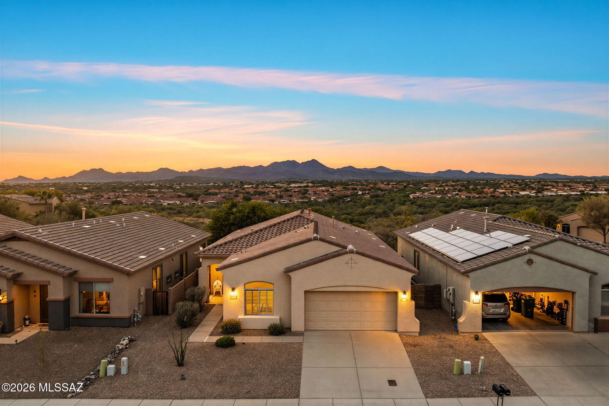 Beautiful mountain views and spectacular Arizona sunsets set the scene for this inviting Rancho Vistoso home! Inside, natural light fills the bright and cheerful living spaces, creating a welcoming atmosphere throughout. The spacious great room flows into a well-appointed kitchen with an island, generous cabinetry, and plenty of room to gather. Offering 4 bedrooms and 2 bathrooms, including a comfortable primary suite with dual vanities, a soaking tub, and separate shower. Step outside to a covered patio and enjoy colorful evening skies, mountain scenery, and easy-care desert landscaping. Ideally situated in Oro Valley, with convenient access to shopping, dining, parks, golf, and outdoor recreation. A wonderful opportunity to enjoy the beauty of Southern Arizona and an easygoing lifestyle!