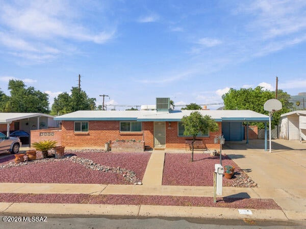 The big-ticket items are already checked off at this Amphi-area gem! Enjoy true peace of mind with a roof just 1 year old, updated windows, new patio doors and fresh paint throughout. Inside, 1,743 sq ft offers 4 bedrooms, 2 baths and a formal living room anchored by a cozy fireplace, ideal for gathering on cool desert evenings. Step outside to your own backyard retreat, where a sparkling pool (redone just 5 years ago) is ready for summer and the driveway doubles as a basketball court. Minutes to Tucson Mall shopping and dining, Jacobs Park and the Rillito River Park trail, with quick access to Oracle Rd, I-10 and the U of A.