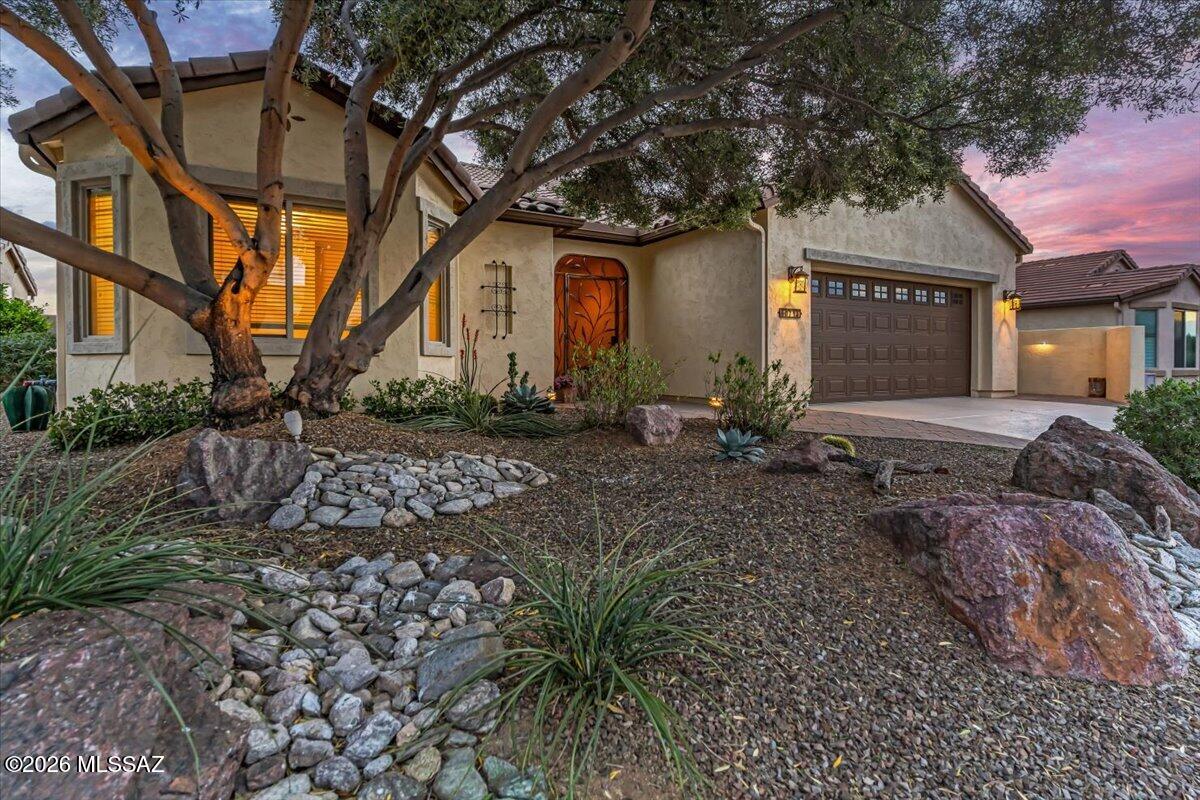 This Artesa model home at Saddlebrooke Ranch comes with spectacular uninterrupted views of both Mt. Lemmon and the Tortolita Mountains! This home has been lovingly cared for and upgraded, giving you peace of mind. Luxurious comforts abound with 2.5 baths, den with double doors and a built-on Murphy bed, remodeled powder room and guest bath, new stainless steel appliances, extended garage with built-in cabinets, epoxy floor and workbench, all-paver patio with pergola and turf, and surround sound. Enjoy the tranquility of desert living from your private backyard from sun up to sunset with full snake fencing, new plantings, and sprinkler/drip irrigation. Enjoy open concept living and a split-bedroom floor plan for privacy of you and your guests. Home was painted inside and out in 2023.