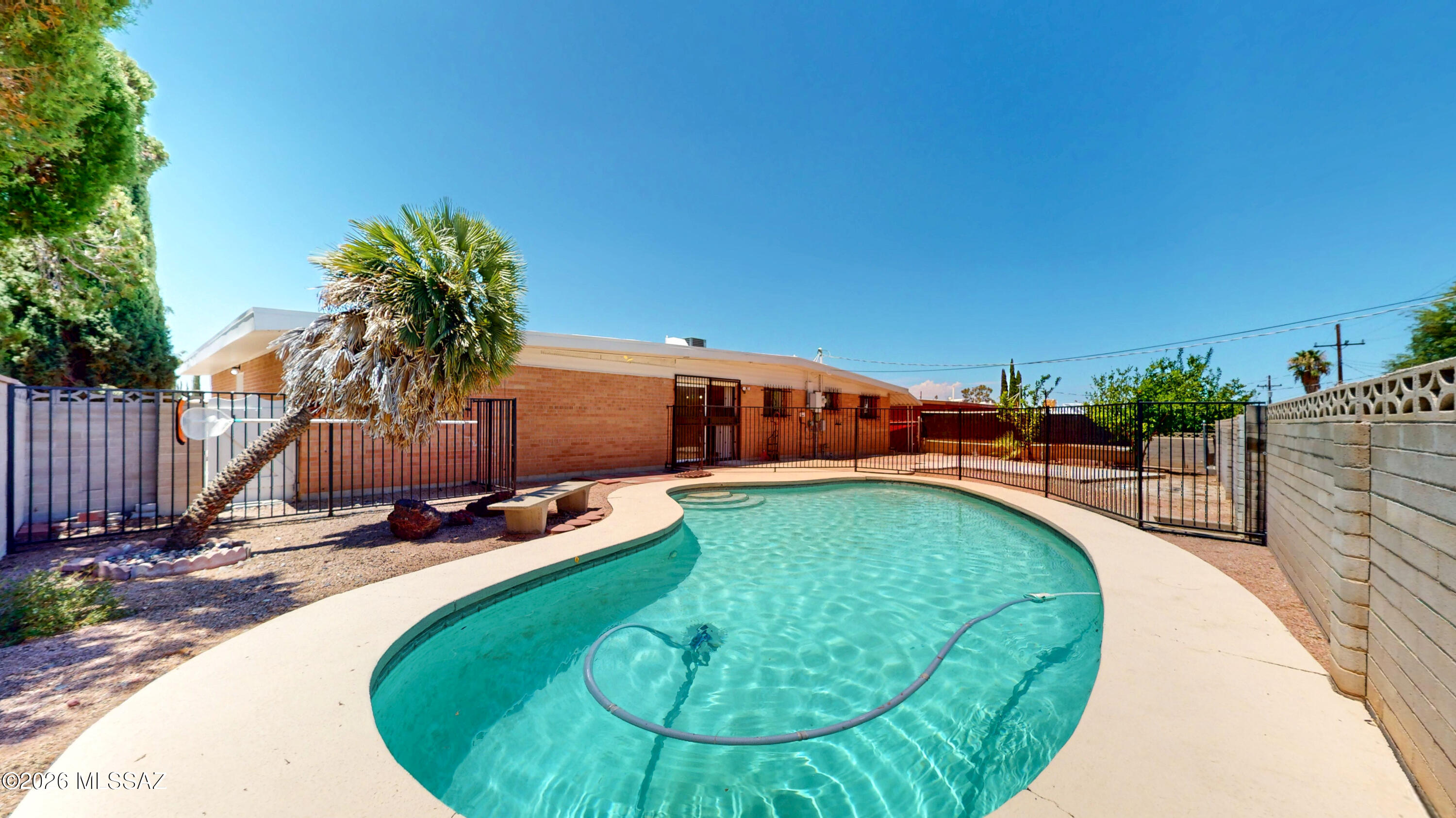 Welcome to this beautifully remodeled 4-bedroom, 3-bathroom home with a dedicated office/den, located on the desirable east side with stunning mountain views and no HOA. Designed with a spacious split floor plan, this home features two primary (double master) bedrooms, offering flexibility for multi-generational living or guests. The inviting living area includes a cozy wood-burning fireplace, creating the perfect gathering space. Step outside to your private backyard oasis with a sparkling pool, ideal for entertaining family and friends year-round. With modern updates throughout, generous living spaces, and an exceptional layout built for hosting, this move-in-ready home offers comfort, style, and convenience in a fantastic location.