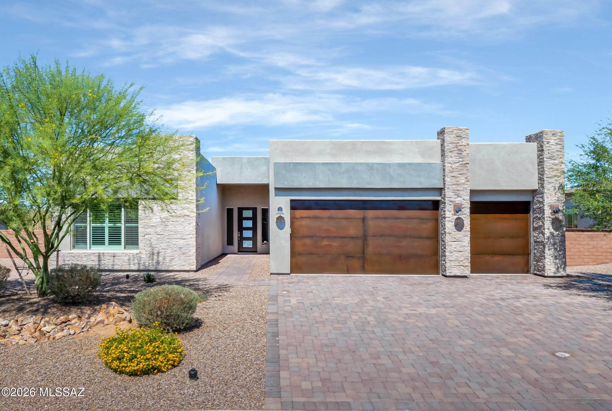 Located within the gated Rancho Vistoso Vermillion enclave of just 29 homes, this beautifully upgraded 2023 built Fairfield Home offers 2,264sf of thoughtfully designed living, blending modern style & privacy. With over $150,000 in upgrades, the home features 3BR/2BA, versatile office & spacious 3-car garage. From the moment you arrive, the cultured stone exterior, paver driveway & upgraded rustic garage doors set the stage for the exceptional quality and attention to detail carried throughout the home. Soaring 12' ceilings and an open concept great room create a light, airy atmosphere ideal for both everyday living & entertaining. The gourmet kitchen is a true centerpiece, showcasing quartz countertops, stainless steel appliances, soft-close cabinetry with pull-outs & functional layout that seamlessly connects to the main living spaces. The split-bedroom floor plan offers privacy, while the expanded owner's suite provides a comfortable retreat with added space & thoughtful design. 18x18" tile flooring runs throughout the home enhancing both style & ease of maintenance. Plantation shutters add a refined touch, while upgraded construction features such as 2x6 framing, a high-efficiency 14 SEER HVAC system, tankless water heater with recirculating pump, and whole-house water filtration system ensure long-term comfort and efficiency. Set on an expansive S acre lot, the backyard has been transformed with extensive paver work, desert landscaping & added snake fencing. With no home directly behind, the setting offers exceptional privacy and a serene outdoor environment. The generous lot size also provides ample space to design and build your dream pool, creating the ultimate Arizona retreat. Large sliding glass doors open to a covered patio w/sun shade, seamlessly blending indoor and outdoor living perfect for enjoying Oro Valley's stunning sunsets and relaxed lifestyle. This is a rare opportunity to own a nearly new, highly upgraded newer home in one of Oro Valley's most desirable gated communities. Tucked away and private yet close to many Oro Valley amenities everyday services all within minutes including top rate-schools, restaurants, coffee, retail, movie theater + live music/events, grocery, medical, library and the Oro Valley Community Center featuring a fitness center, Tennis, Pickleball & Racquetball courts, pool & golf