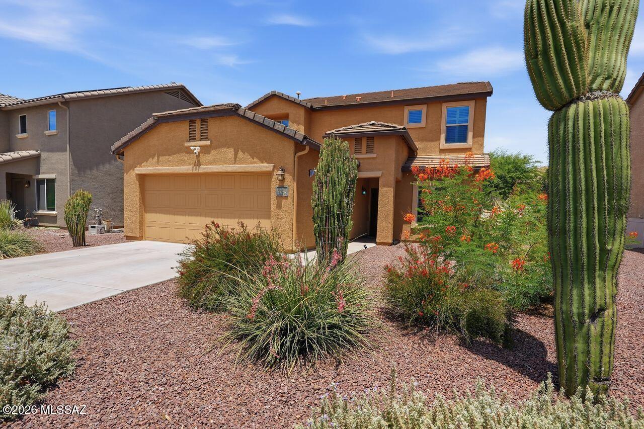 The spacious kitchen w/quality upgraded appliances & views to the backyard is a nice place to cook a meal. The large dining area off the kitchen is convenient & opens to the backyard. The downstairs has luxury laminate flooring, a den/office room, a laundry room & a half bath. Newer stacked washer & dryer & a freezer stay. The upstairs has 4 carpeted bedrooms, walk in closets & 2 full updated baths. Front entrance has a solid security door, there are shutters through out & a 4 ft extended  garage. You will enjoy the private enclosed backyard w/covered patio, fruit trees of lemon & orange, a grapevine, rose bushes & a sweet jasmine vine, garden boxes & summer grass. We love our backyards in Arizona! Located in a neighborhood w/lots of amenities. This home is clean & enjoyed for many years.