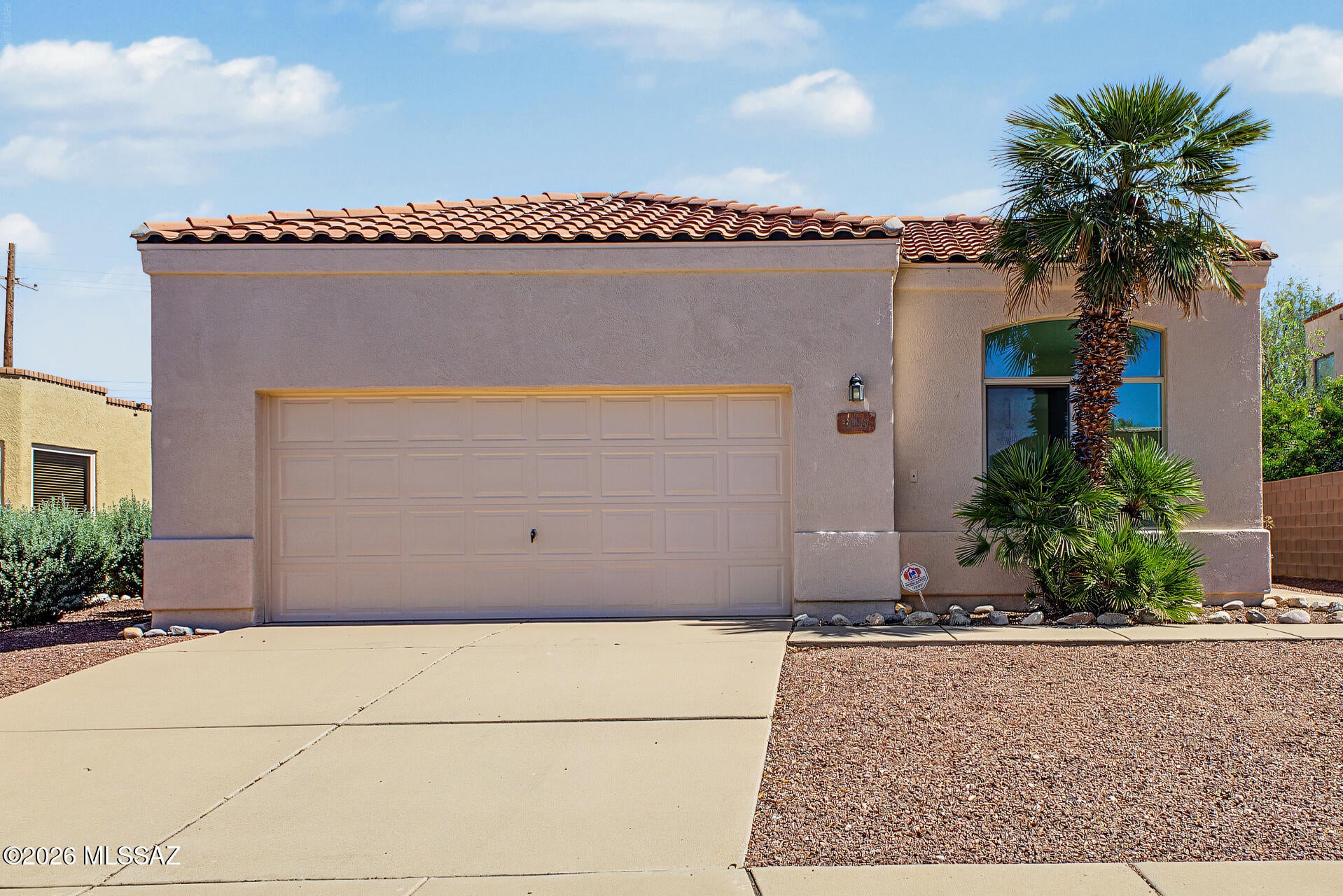 Brand-new double-pane windows with a transferable warranty were just installed throughout! Steel frame and brick construction in the garage. This 3-bedroom, 2-bath home with a 2-car garage offers a functional layout with multiple living spaces, solid 8'' stucco construction, and plenty of natural light. Tile and carpet flooring and ceiling fans throughout add comfort. The kitchen features ample cabinet space, recessed lighting, and a breakfast bar overlooking the great room with sliding door access to the covered patio. The primary suite includes a walk-in closet and private bath with a glass-enclosed shower. The backyard offers room to relax, entertain, or customize, with unimpeded mountain views. Located in the sought-after Vail School District, close to shopping and dining.
