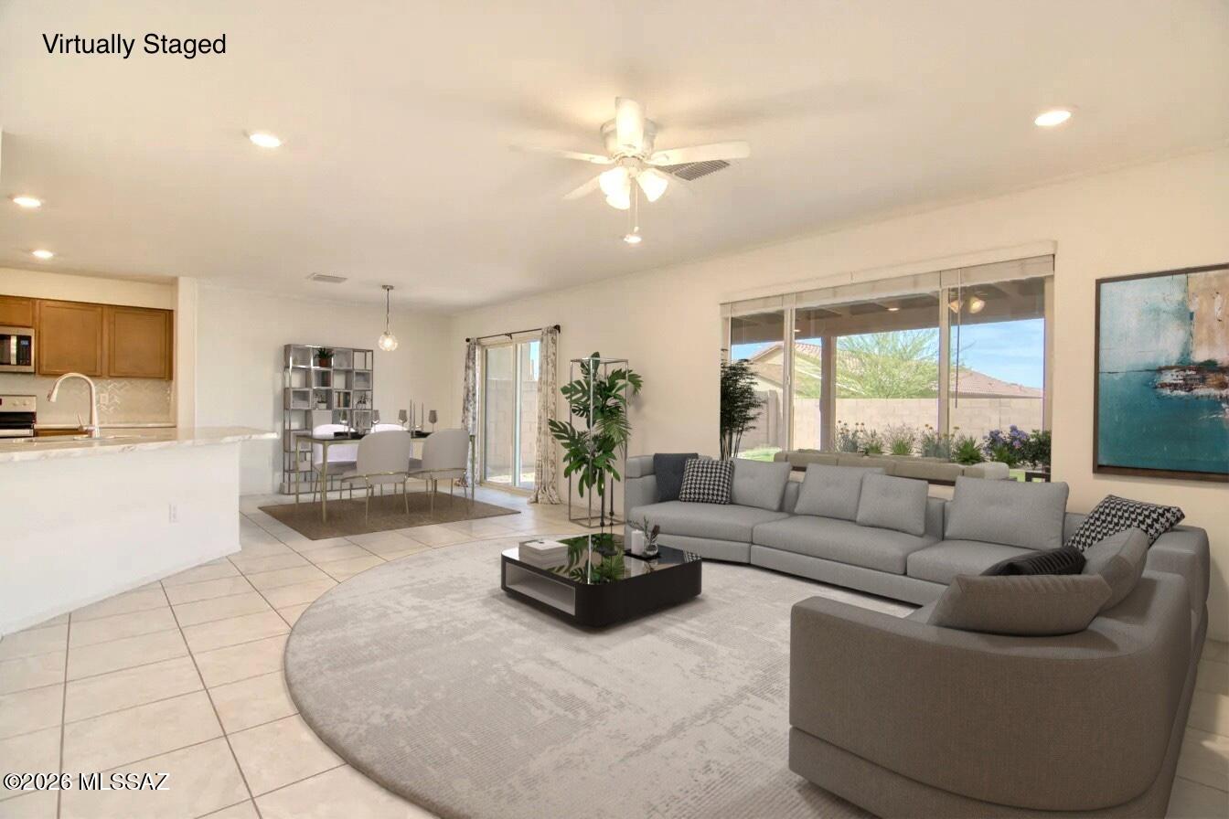 PRICED BELOW COMPS!! Like new, squeaky clean home ready for you and your family! 3 bedroom + office and a loft space! Work from home, let the kids have a playroom, move in the in-laws, or whatever you need, this home has the space. 2 car garage and freshly painted downstairs. Large, private backyard ready for your summer bbq's.  Located in Bella Tierra reserve, this KB community offers a dog park and playground. Just 15 minutes from Davis Monthan, close to the airport, hiking trails and bike paths. Priced to sell this home won't last long! Come and experience this gem today!