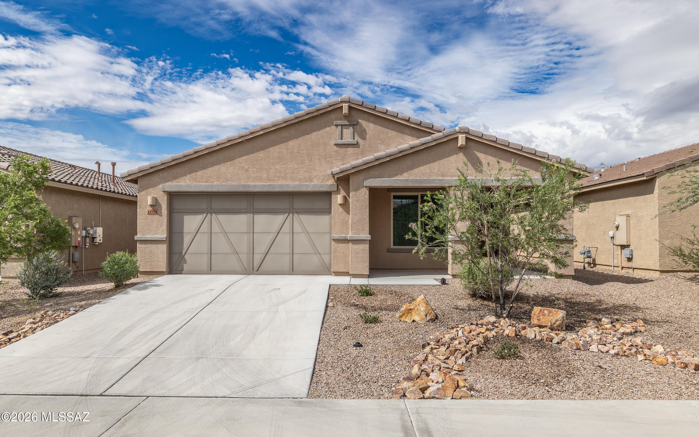 Built in 2022, this 3 bed, 2 bath home offers 1,960 sq ft of energy efficient comfort & modern convenience. Smart features include an Ecobee thermostat w/ Follow-Me technology, integrated & elegant Hunter-Douglas window & blind coverings conveniently controlled via remote controls or phone app. Enjoy living room surround sound & ambient lighting. The updated kitchen has a gas range, ceramic backsplash, granite B&W countertops w/ an extended bar, and an RO system. The primary room is tucked away in back allowing for ultimate quiet & privacy. The spacious 3 car garage offers extra room for storage or hobbies, has epoxy flooring, a 40g water heater, the water softener sys. which is owned outright, pull down ladder access to the attic & a 48 Amp EV charger for convenience. AND SO MUCH MORE!