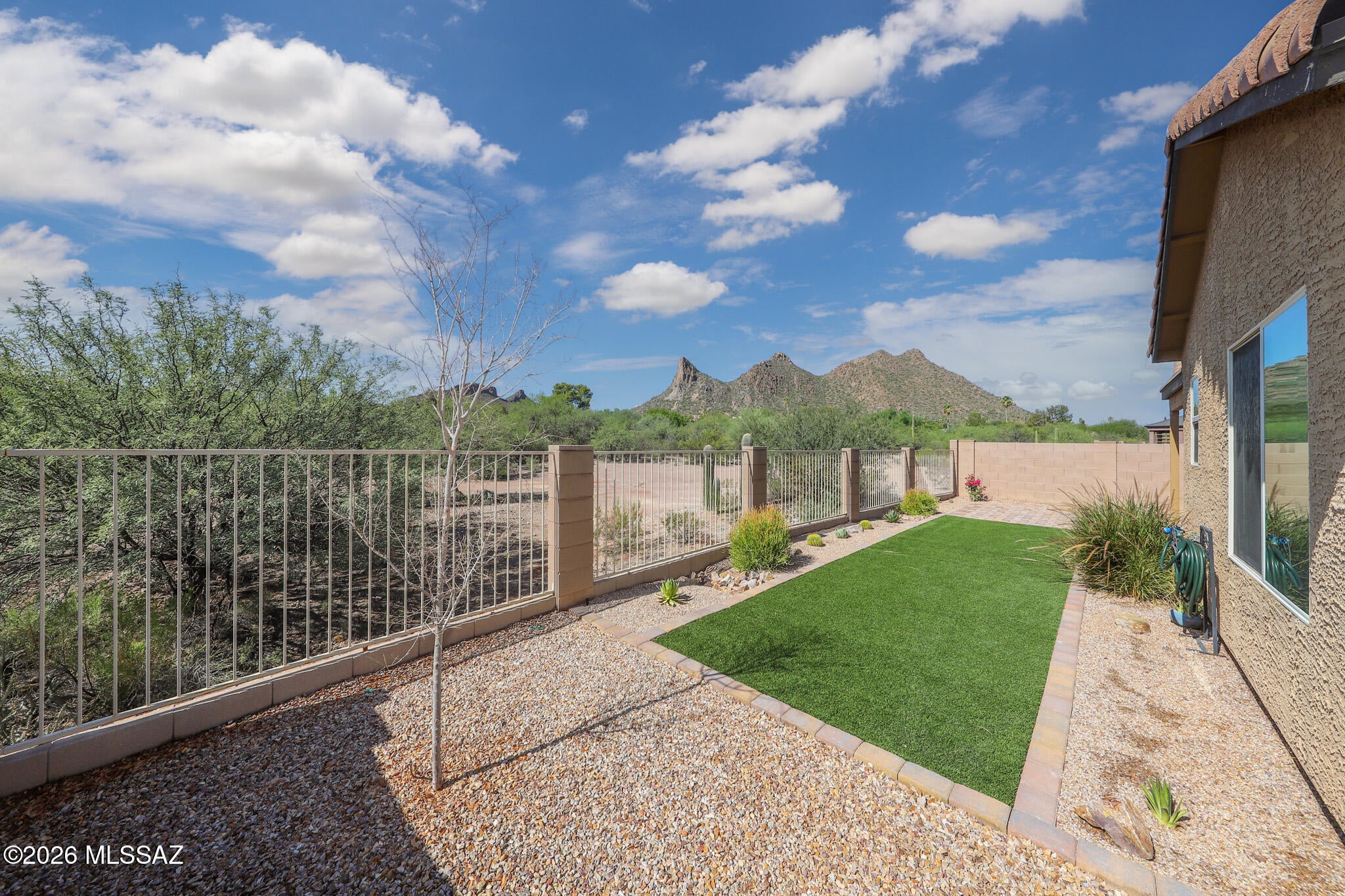 Beautiful newer 3-bedroom, 2-bath home with spectacular mountain views and a view-fenced backyard! Enjoy a bright, open great-room design with a desirable split-bedroom floorplan. The spacious primary suite features a private ensuite bath and walk-in closet. The kitchen offers stainless steel appliances, a pantry, and a large island perfect for meal prep and entertaining. Nicely landscaped rear yard provides a wonderful space to relax and take in the views. Separate laundry room includes washer and dryer. A beautiful home with modern finishes, comfortable living spaces, and incredible scenery!