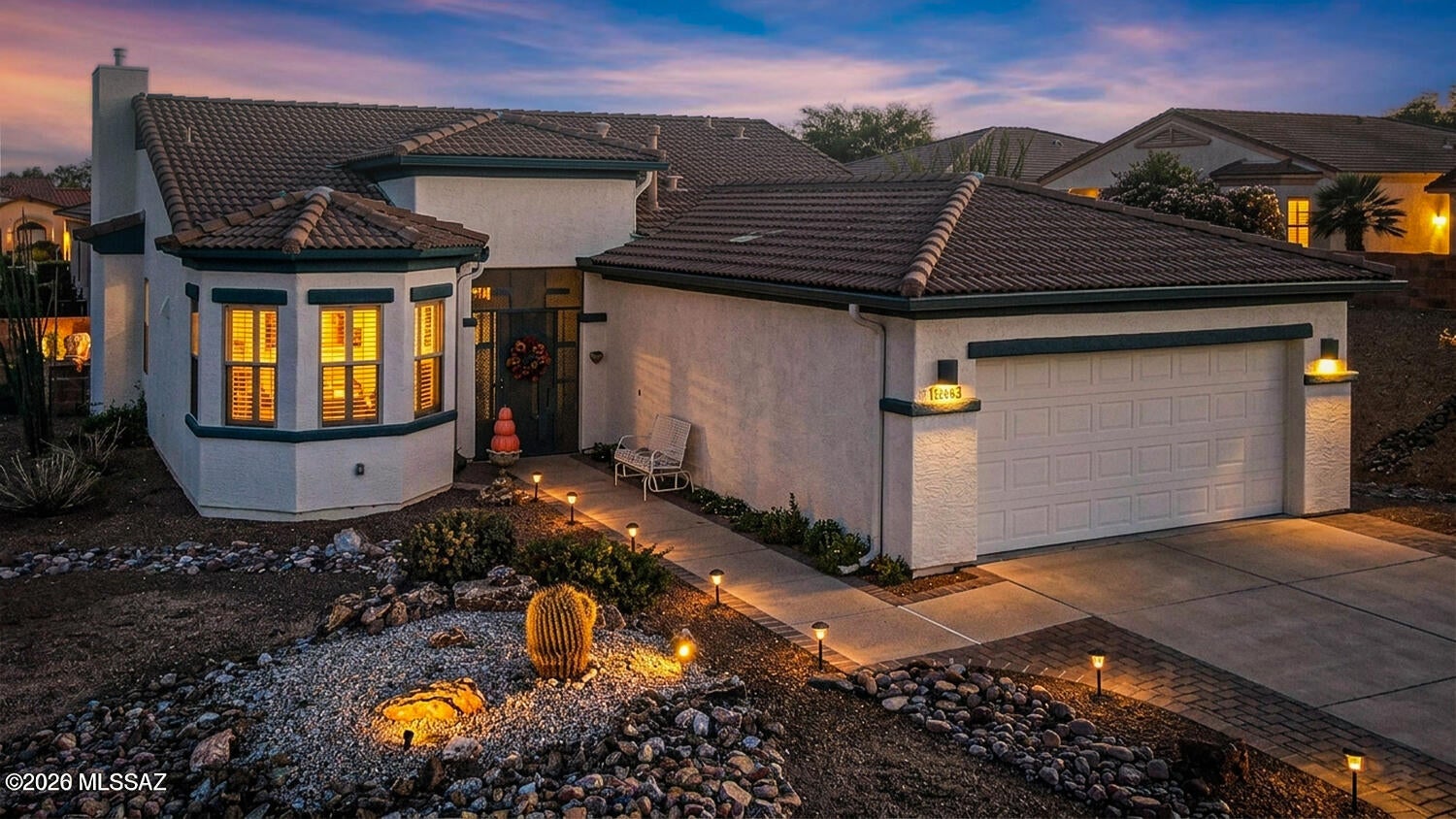 BEAUTIFULLY REMODELED WITH FLEXIBLE LIVING & AN EXTENDED GARAGE YOU'LL LOVE! Beautifully situated on a desirable corner lot, this thoughtfully remodeled 2-bedroom, 2-bath home offers a versatile Arizona room, an oversized extended garage, and stylish upgrades throughout. Step inside to a bright, inviting interior featuring elegant ceramic tile flooring, plantation shutters, designer lighting, contemporary wood ceiling fans, and a cozy gas fireplace that creates a warm focal point in the spacious living area. The beautifully updated kitchen is sure to impress with granite countertops, crisp white cabinetry, newer stainless-steel appliances, including a gas range installed in 2024 and a charming breakfast nook perfect for casual dining. Offering exceptional flexibility, the Arizona room features its own mini-split system installed in 2024 and can easily serve as a media room, home office, fitness area, craft room, or comfortable guest retreat. The spacious primary suite provides a peaceful escape with a bay window, walk-in closet, additional storage, and a well-appointed ensuite bathroom featuring dual sinks and executive-height countertops. The guest bedroom includes a built-in Murphy bed and desk, allowing the room to transition effortlessly between a bedroom and functional workspace. Car enthusiasts and hobbyists will appreciate the rare extended garage, complete with sleek epoxy flooring and a separate mini-split system installed in 2024. This climate-controlled space is ideal for a workshop, hobbies, additional storage, or accommodating larger vehicles. Outside, the beautifully landscaped backyard invites you to relax and unwind among elegant pavers, low-maintenance artificial turf, a tranquil fountain, and peaceful partial mountain views. Conveniently located near a GVR recreation center, shopping, restaurants, farmers markets, and easy access to I-19, this beautifully updated, move-in-ready home delivers comfort, versatility, and the very best of Green Valley living!