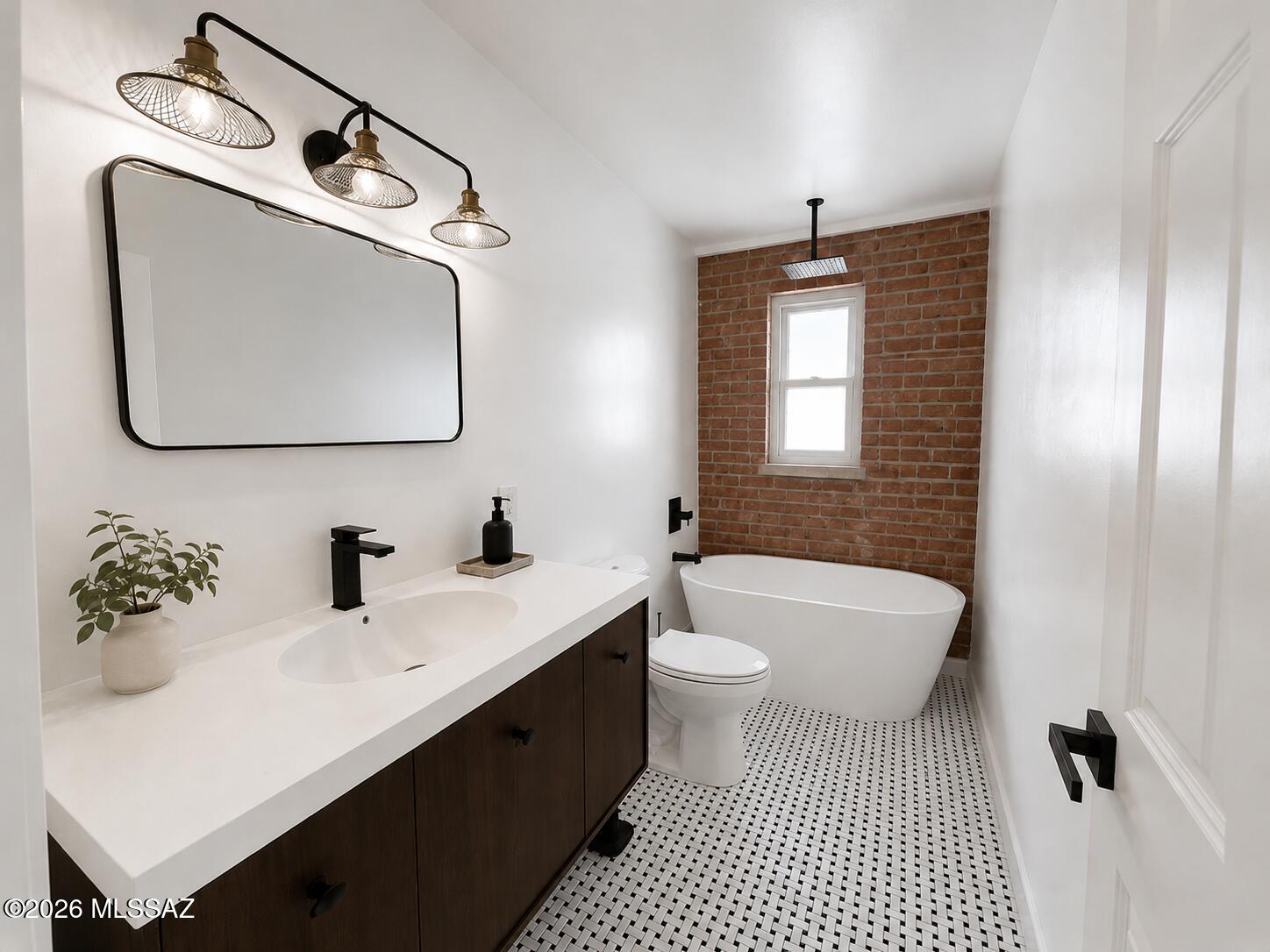 Mid-century character meets a thoughtful modern renovation in this distinctive 1962 Tucson home. Original brickwork, exposed wood beams, vaulted wood-paneled ceilings, a statement brick fireplace, and an original built-in open-flame grill preserve the warmth and architectural personality of the home, while extensive updates make the property move-in ready.
At the center of the home, the renovated kitchen features olive-toned custom cabinetry, quartz countertops, stainless-steel appliances, a generous island, and an open layout that connects naturally to the main living spaces. New flooring, fresh finishes, and abundant natural light create a bright, cohesive feel throughout.
A dramatic exposed timber beam imported from Italy frames the transition between the kitchen and living space Sell Just beyond, an additional living area showcases original brick walls, the built-in open-flame grill, and a warm wood ceiling accented by white-painted beams, a striking combination of texture and character that feels distinctly Tucson.
The bathrooms have been completely renovated with clean, modern finishes that complement the home's vintage character.
Outside, a large covered patio opens to a expansive backyard with a newly raised privacy fence, mature shade trees, and plenty of room to entertain, garden, or create your own desert retreat. The generous lot offers ample parking and a true blank canvas for enjoying Tucson's indoor-outdoor lifestyle.  Seller is Licensed to sell Real Estate in the State of Arizona. Member/Owner/Agent.