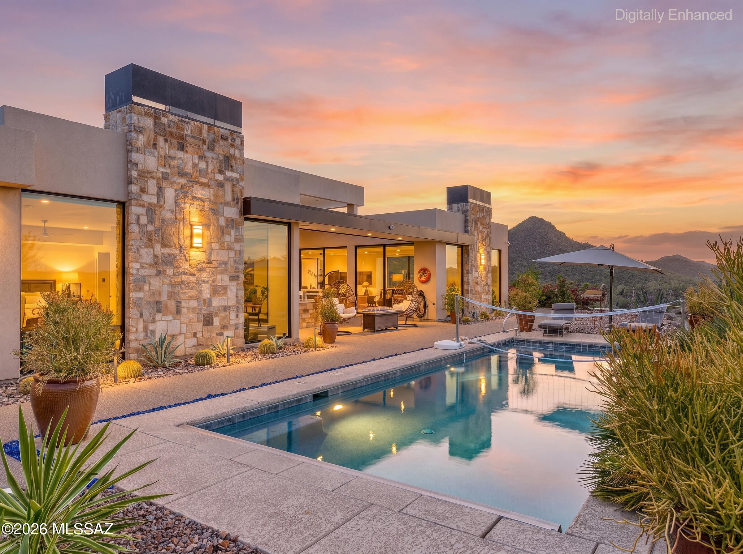 Wow! Live a life of absolute luxury at this gorgeous 3 bedroom 2.5 bathroom 3475sqft newly built gem. Breathtaking views from a quiet lot in the west Tucson mountains. Built in 2017 this stunning property boasts contemporary style with privacy and all of the features you'd expect, and more! The yard is perfectly curated and makes for great entertaining or relaxing evenings with a view of Tucson you'll never get tired of. Automatic security lighting, and decorative lighting all around. Fire pit and solar heated pool with rock and desert landscape, plus real grass patch for pets. Plants on an automatic watering system for low maintenance. Inside you'll find spacious carpeted bedrooms. Large tile flooring throughout, built in salt water fish tank with third party maintenance included. Primary suite includes beautiful glass walls with battery powered shades. Huge walk in closet, and dual vanity sink, deep soaking tub and separate walk-in shower. Laundry suite includes washer and dryer, cabinetry, extra fridge and freezer and utility sink. Four car garage! Greenhouse! The list goes on and on, come and see it for yourself on an exclusive tour with our leasing agent.