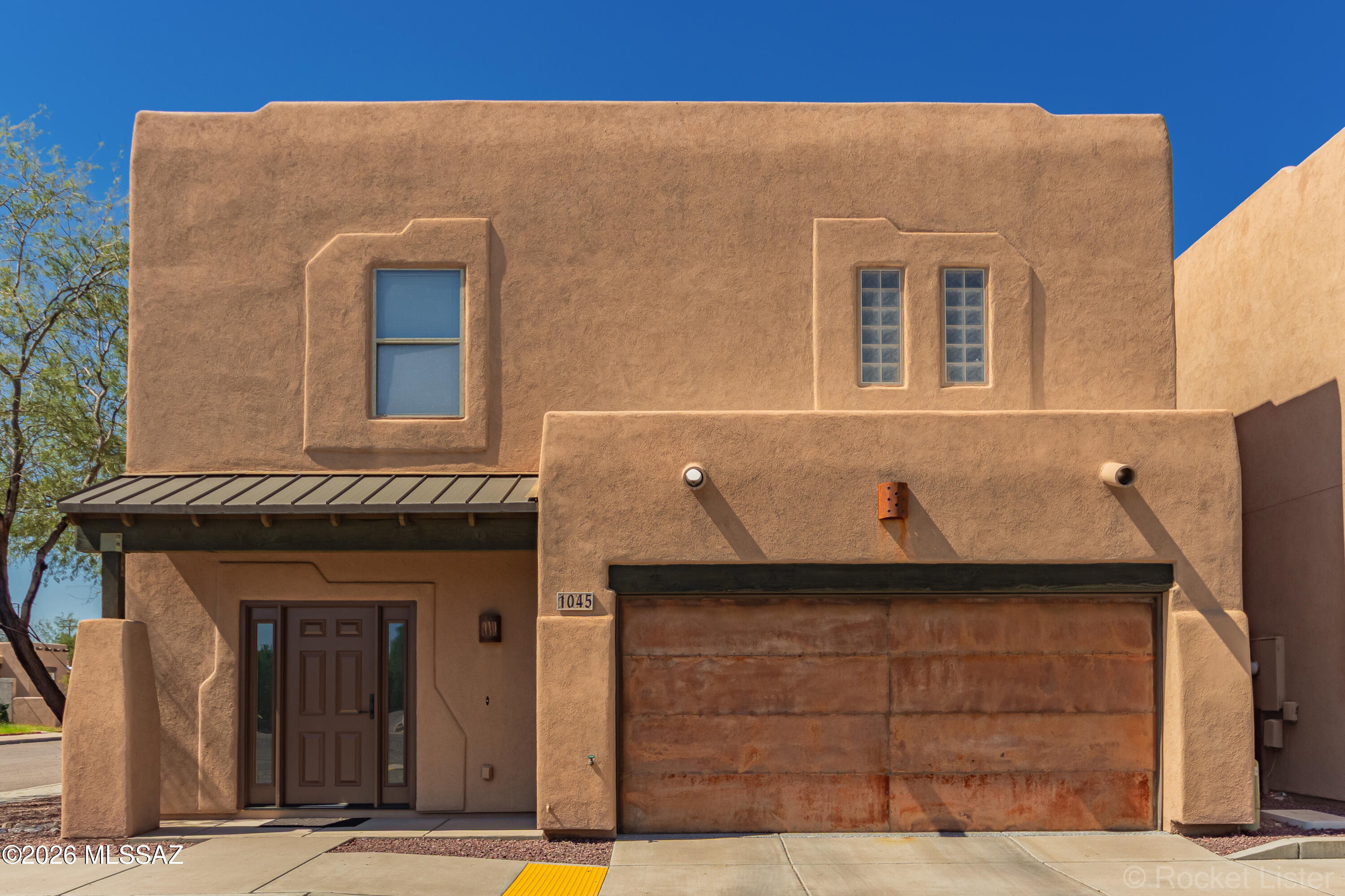 This one is located in a small quiet community tucked away in the central area.  These 2 story pueblo style homes are in a great location close to everything.  This home is in excellent condition and features upgraded counter tops, cabinets, fixtures and even has full owned solar allowing for very LOW utility bills.  There is a upstairs balcony that gives you unobstructed views. True pride in ownership through out this home.
 1. Solar Panels installed 2021- Value $30,000

2. Roof resealed and Tilex Membrane added in 2021 prior to solar panels- warranted through 2031

3. New Hot Water Heater 2022- Value $1,500

4. New HVAC Heat Pump 2023- Value $7,500

5. Front door and slide windows new 2025- Value $5,000

6. Garage floor coated with epoxy in 2026- Value $2,500
 
A must SEE!!!