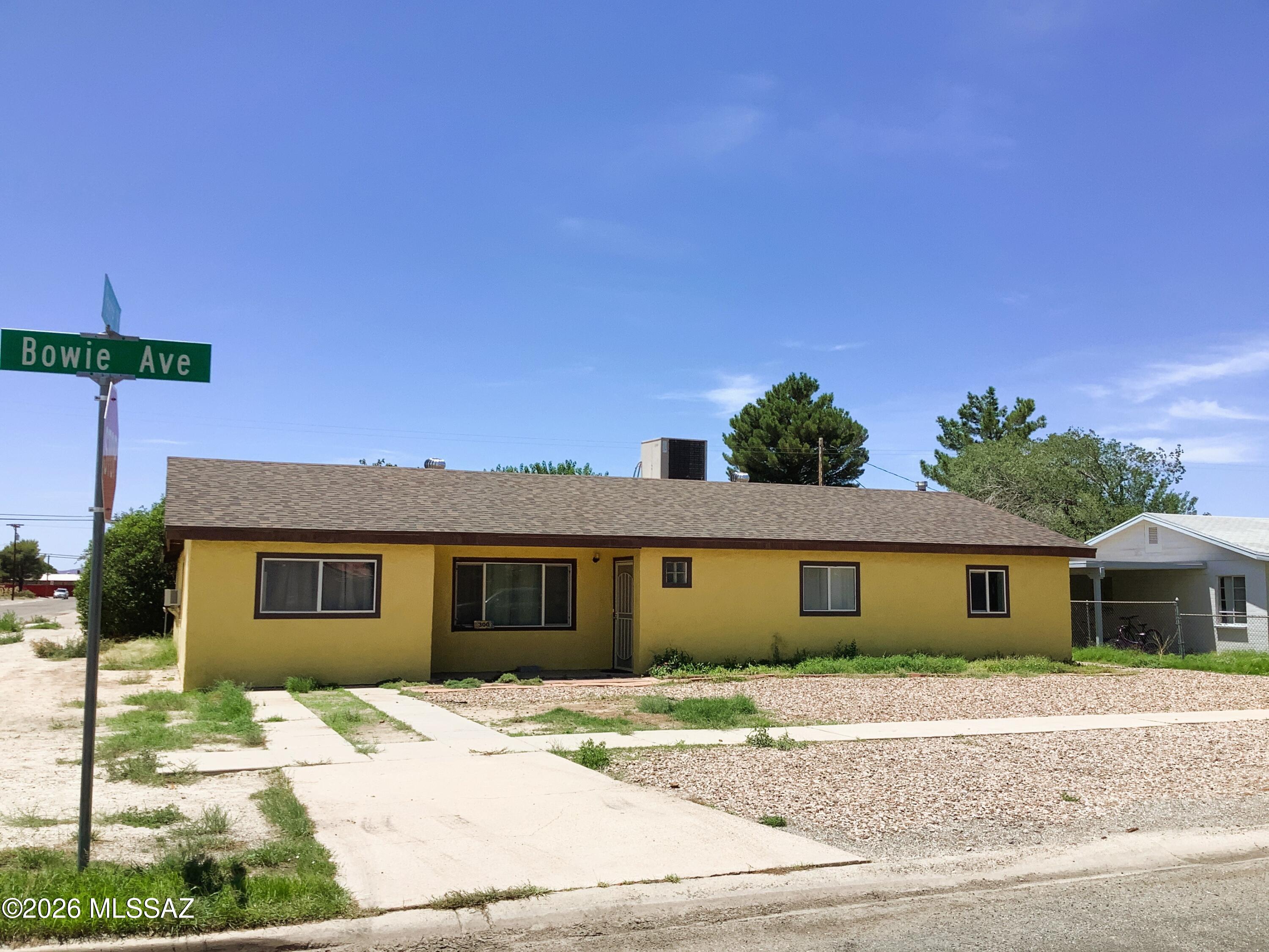 BRAND NEW ROOF w/warranty. Come check out this 2465' home on corner lot.  This home offers a nice size living room, very large family room, office/den with its own outside private entrance, fantastic large eat-in-kitchen with tons of cabinets, pantry, island & French doors to covered patio. A formal dining room, large laundry room with sink & backyard access. The Primary bedroom has its own sitting/exercise room & a hallway w/closet that leads into a very large Primary Bedroom with a walk-in closet, Bathroom & French doors to the covered back patio. The backyard is large enough to have a play area, 1 car garage, two nice size storage sheds and dog run, and all fenced in with alley access. This is a great family home with plenty of space to roam. The property also comes with Home Warranty.