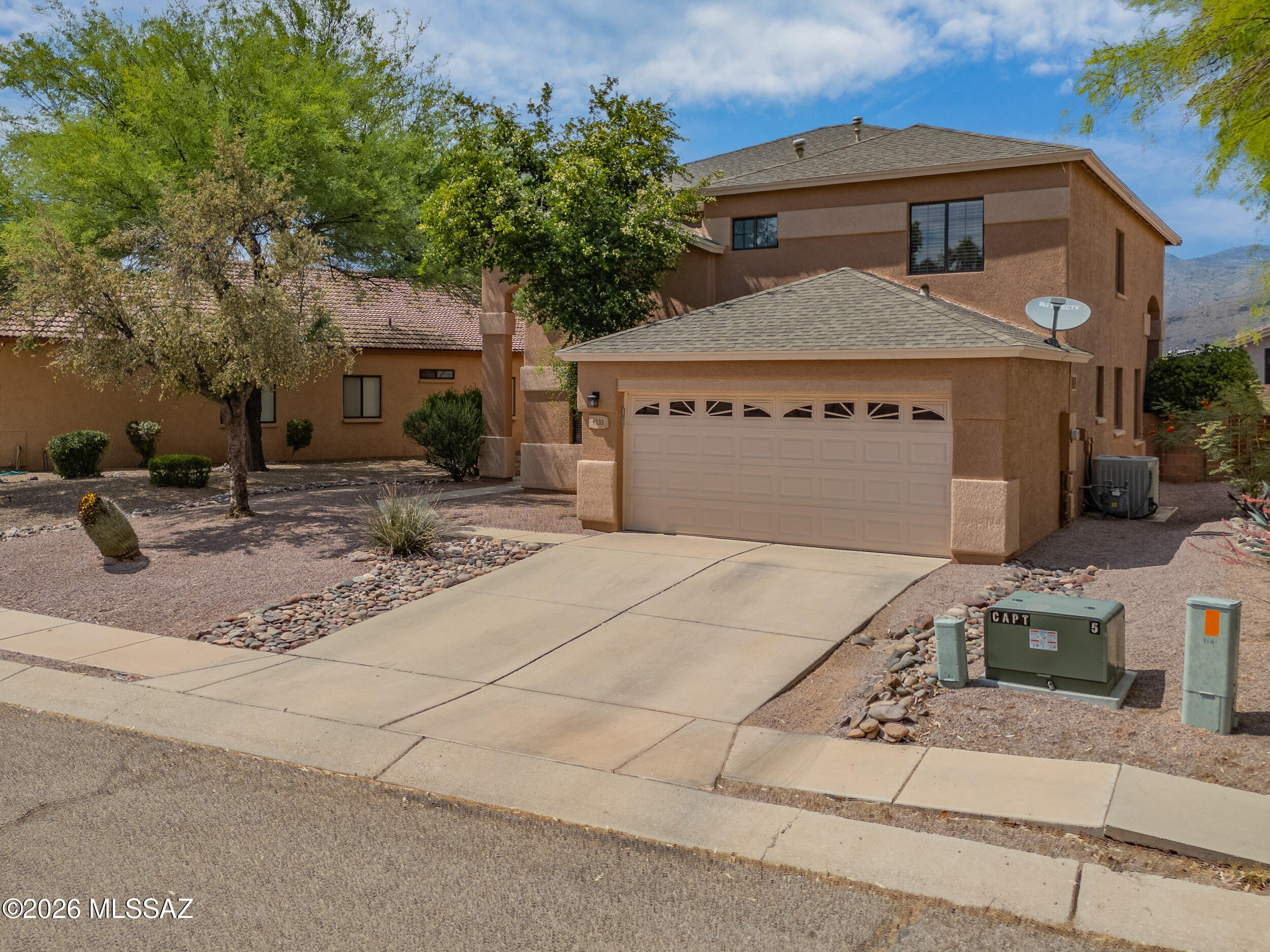 Nestled in the heart of the highly desirable Tanque Verde community, this move-in ready 4-bedroom, 3-bath home offers the perfect blend of comfort, flexibility, and outdoor lifestyle. Just minutes from the base of iconic Mount Lemmon, this location is a dream for families and outdoor enthusiasts alike - surrounded by some of Tucson's best hiking, cycling, and scenic desert recreation.

Enjoy easy access to breathtaking trails, mountain adventures, and nearby family-friendly parks including Agua Caliente Park and McDonald Park, where the beauty of the Sonoran Desert comes to life with walking paths, wildlife, playgrounds, and open green space. The area is also known for sought-after school district options, adding even more appeal for growing families. Inside, the home features a spacious versatile floor plan with soaring ceilings and abundant natural light throughout. The main level includes a bedroom and full bath, ideal for guests, multi-generational living, or a private office setup. The kitchen is designed for both everyday living and entertaining, complete with stainless steel appliances, a large pantry, breakfast bar, and seamless flow into the eat-in nook and expansive great room. A formal dining room and separate den provide additional flexibility for work, play, or gathering spaces. Upstairs, the generous primary suite offers a relaxing retreat with a walk-in closet, dual vanities, jetted tub, and separate shower. Secondary bedrooms are thoughtfully positioned for privacy and comfort. Beyond the home itself, enjoy the convenience of being within walking distance to shopping, restaurants, fitness centers, medical offices, local pizza spots, and a neighborhood beer garden, all while living in one of Tucson's most scenic and adventure-filled communities.