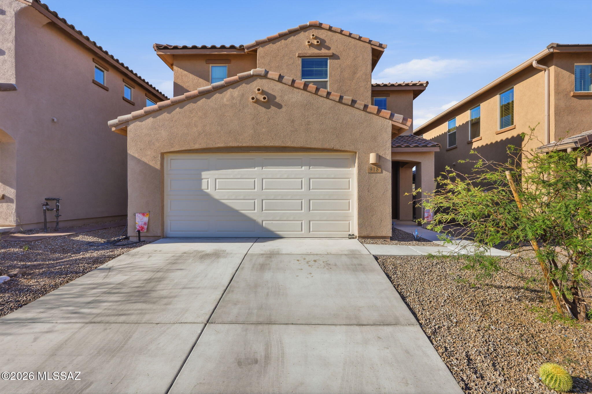 Welcome to this stunning VA Assumable Award-Winning Rancho Sahuarita Showcase Home- voted ''Best on Tour'' by local realtors, offering 2,694 sq ft of modern living space. Featuring 4 bedrooms, 3 full bathrooms, and a versatile loft, this home is designed for comfort and style. The open floor plan showcases ceramic plank tile flooring, a bright kitchen with white cabinets and quartz countertops, and custom accent walls in the living room and loft. A convenient downstairs bedroom adds flexibility for guests or a home office. Step outside to a beautifully designed backyard built for entertaining. Move-in ready and thoughtfully upgraded throughout, this home is a must-see!