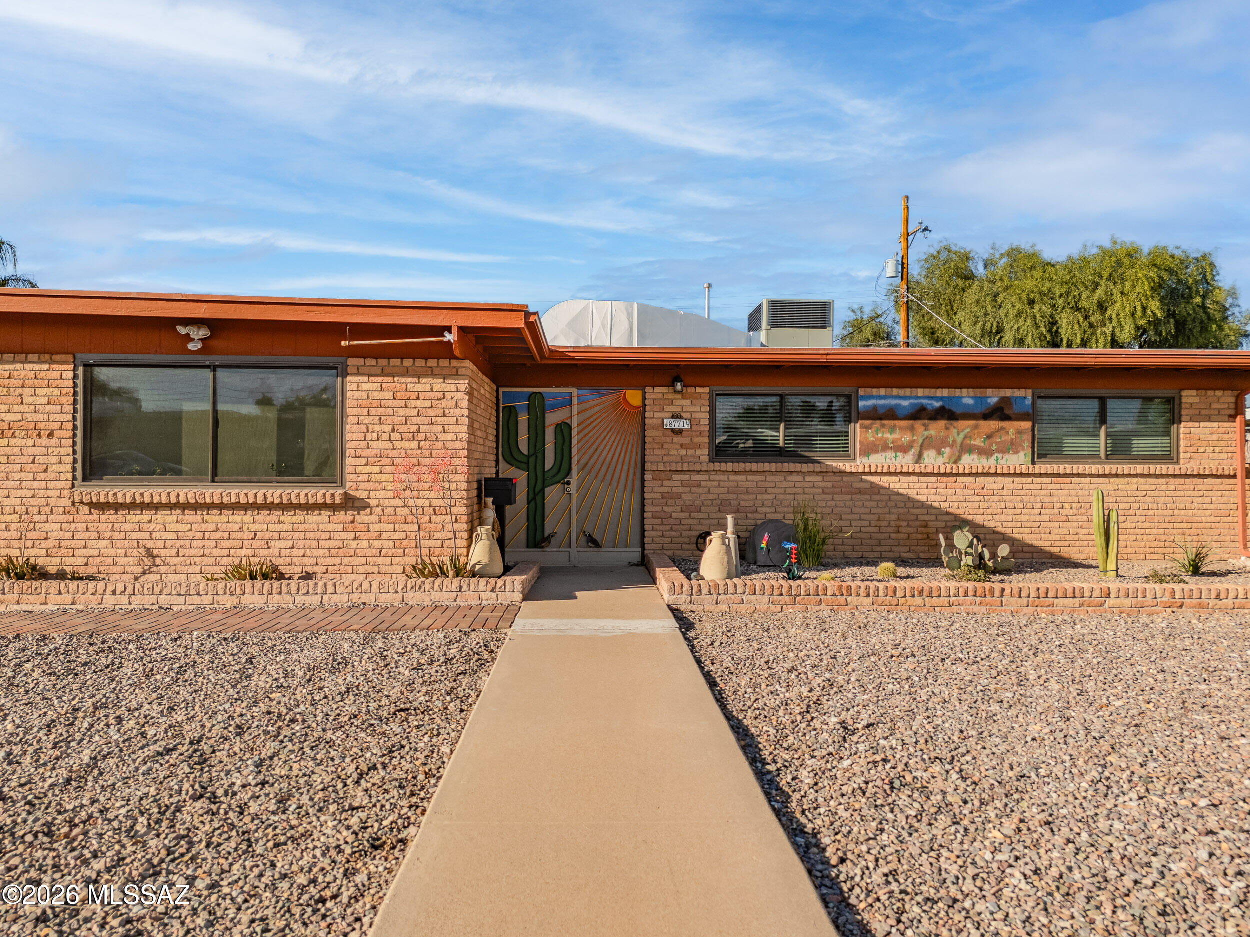 Enjoy stunning views of the Rincon and Catalina mountains from the privacy of your backyard. Solid brick 4 bedroom home featuring a newer HVAC, double pane windows, garage with ample storage, shaded paved patio, professional landscaped front and back yards, recently recoated roof and so much more. So many custom touches and no HOA! All conveniently located near great schools, shopping, and dining! Property is occupied, please do not disturb occupants without an appointment, call or text to schedule a showing.